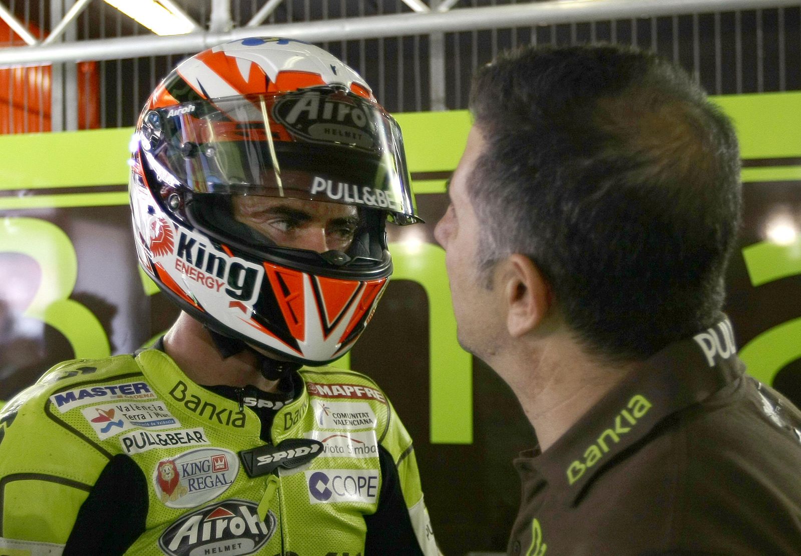 Aprilia 125cc rider Nicolas Terol of Spain celebrates his pole position with his team manager Jorge Martinez Aspar after the qualifying practice of the Catalunya MotoGP Grand Prix at the Montmelo race track, near Barcelona