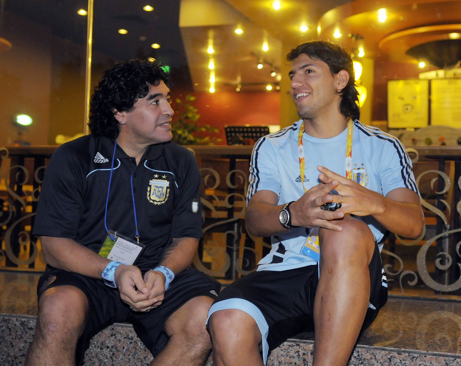 Former Argentine soccer star Maradona talks to Argentina's Aguero at the Beijing 2008 Olympic Games