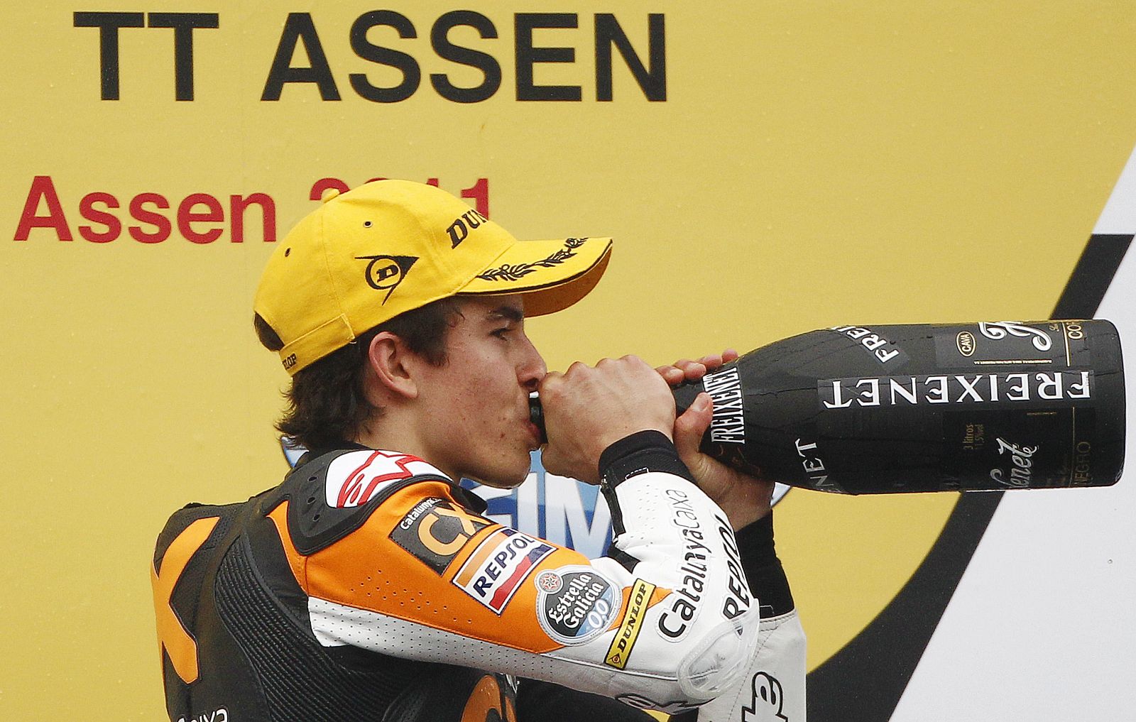 Suter Moto2 rider Marc Marquez of Spain drinks champagne after winning the Moto2 race of the Grand Prix in Assen