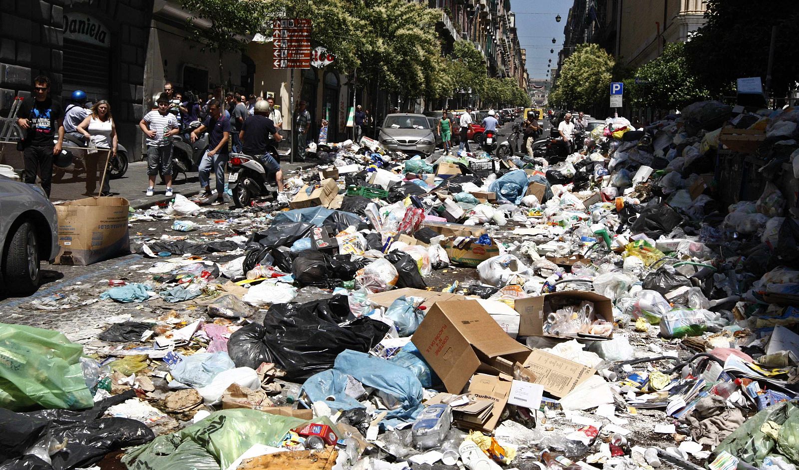 Rubbish is seen in the street during a protest in downtown Naples