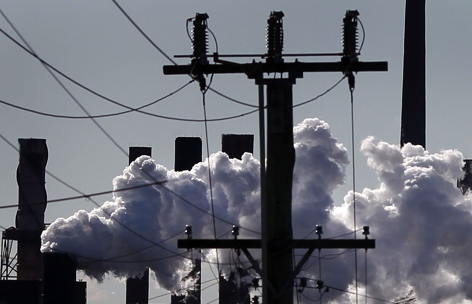 Vapour pours from a steel mill chimney in the industrial town of Port Kembla