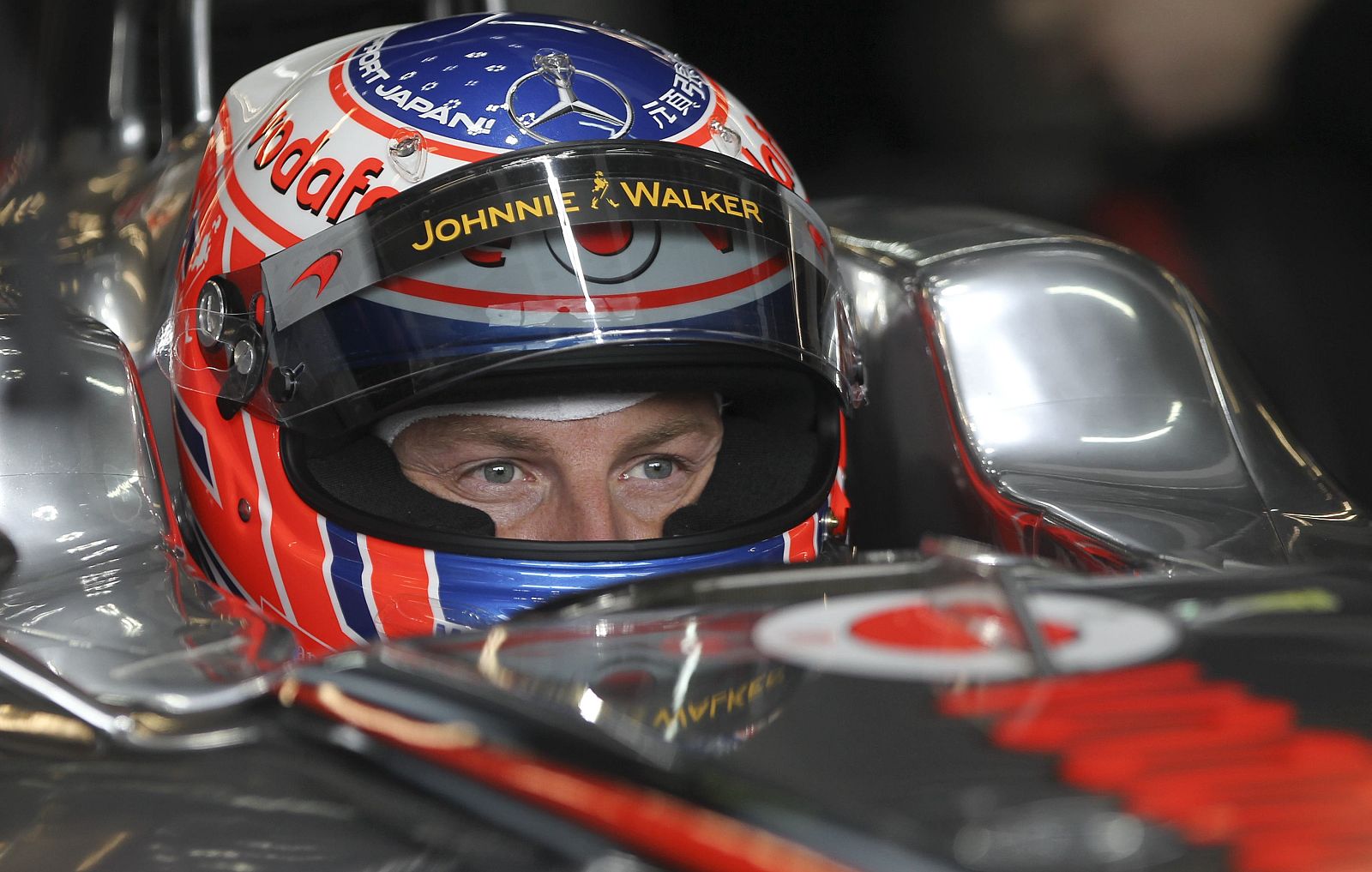 McLaren Formula One driver Button of Britain concentrates in his car during a practice session of the German F1 Grand Prix at the Nuerburgring circuit