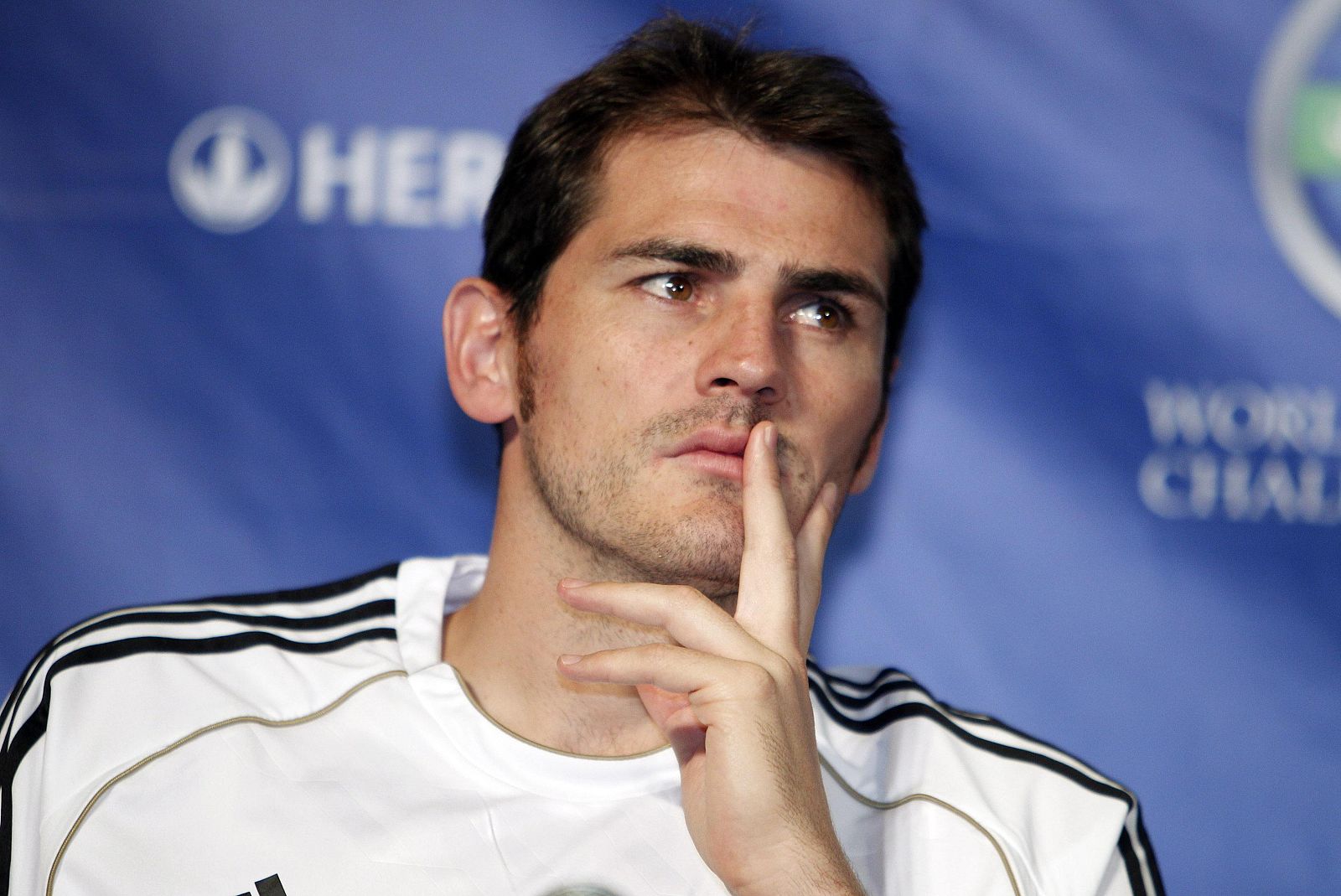 Real Madrid's Casillas listens to questions from the media at a news conference in Los Angeles