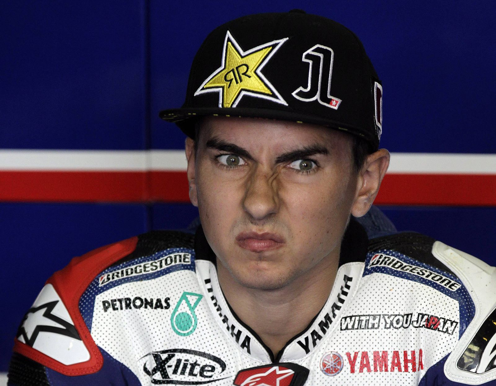 Yamaha MotoGP rider Jorge Lorenzo of Spain grimaces before a free practice session of the Czech Grand Prix in Brno