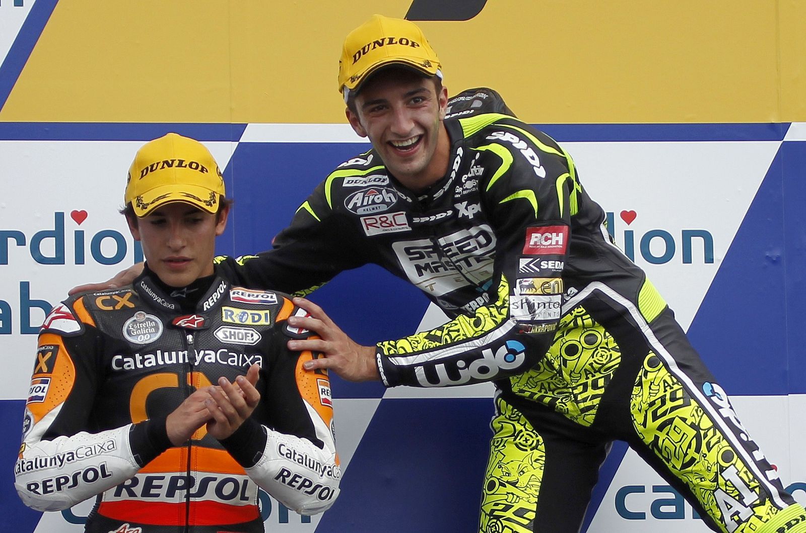 Iannone of Italy jokes with second placed Marquez of Spain during the award ceremony after the Czech Grand Prix in Brno