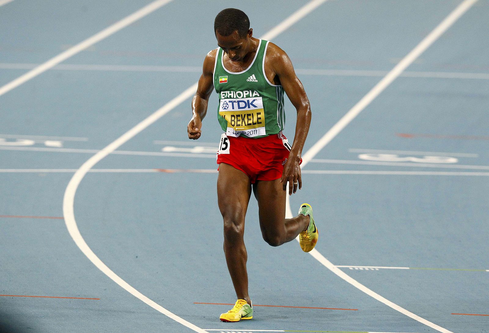 Kenenisa Bekele of Ethiopia leaves the track after pulling out of the men's 10,000 metres final at the IAAF World Championships in Daegu