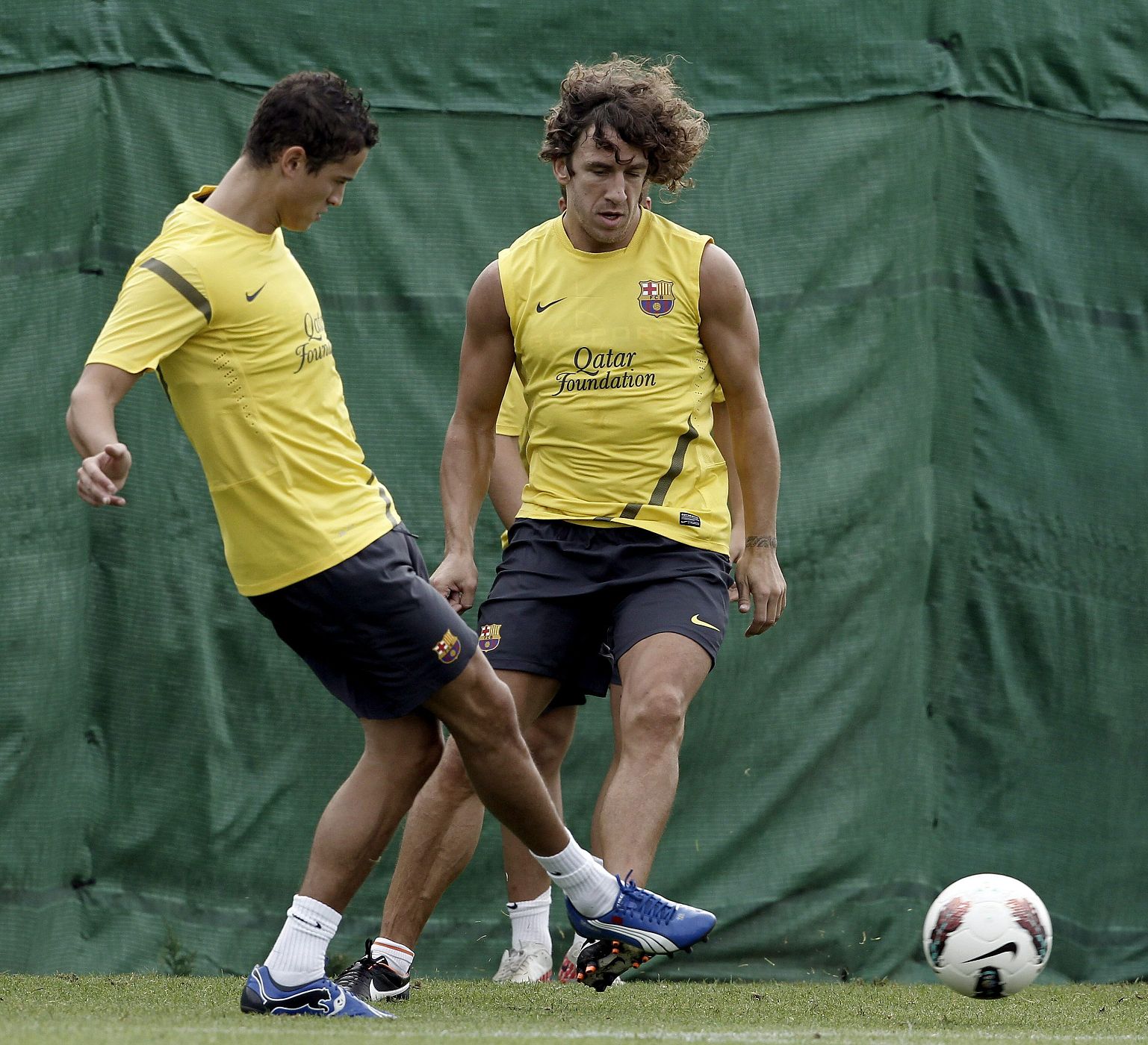 PUYOL Y AFELLAY EN EL ENTRENAMIENTO DE HOY DEL FC. BARCELONA