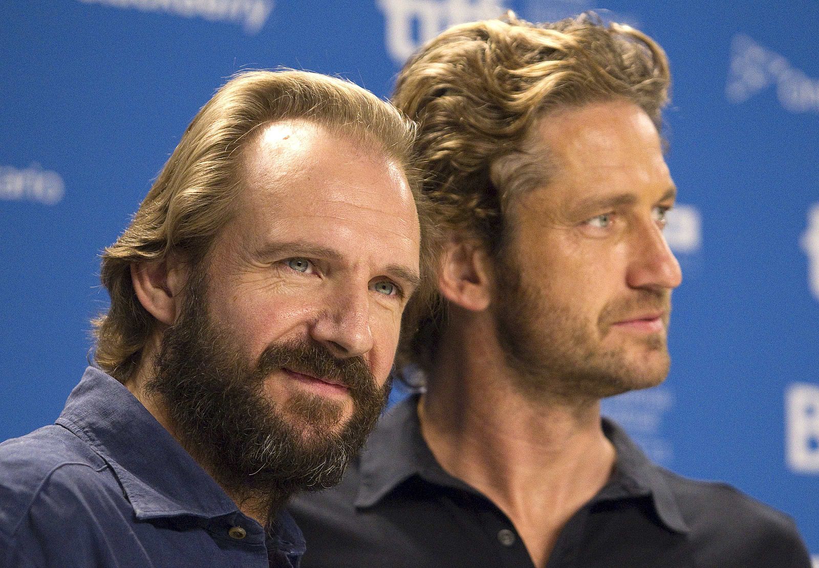 Director and actor Ralph Fiennes and actor Gerard Butler attend the news conference for the film "Coriolanus" at the 36th Toronto International Film Festival in Toronto