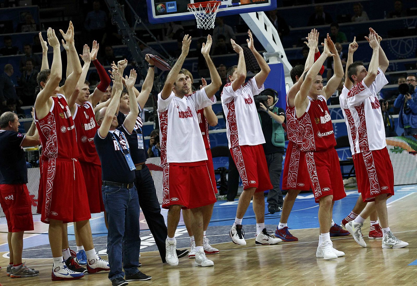 Russian players celebrate their victory against Macedonia after the FIBA EuroBasket 2011 third place basketball match in Kaunas