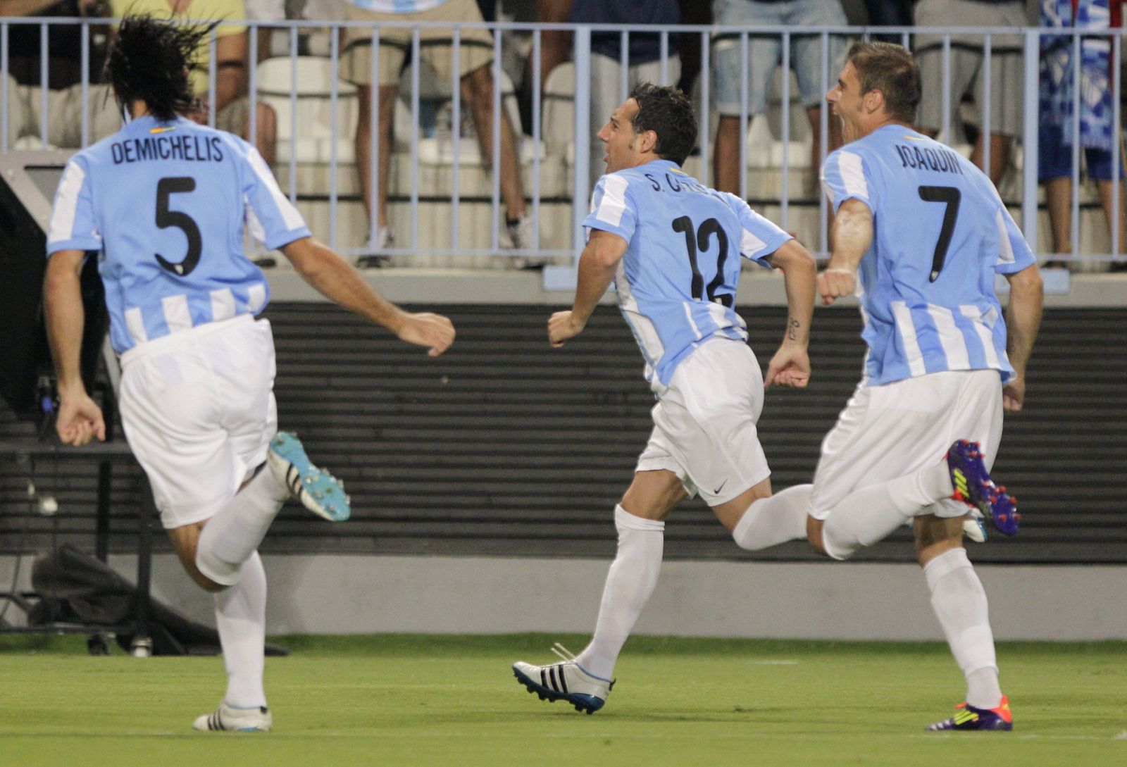 Los jugadores del Málaga, Santi Cazorla, Joaquín Sánchez y Martín Demichelis, en una imagen de archivo.
