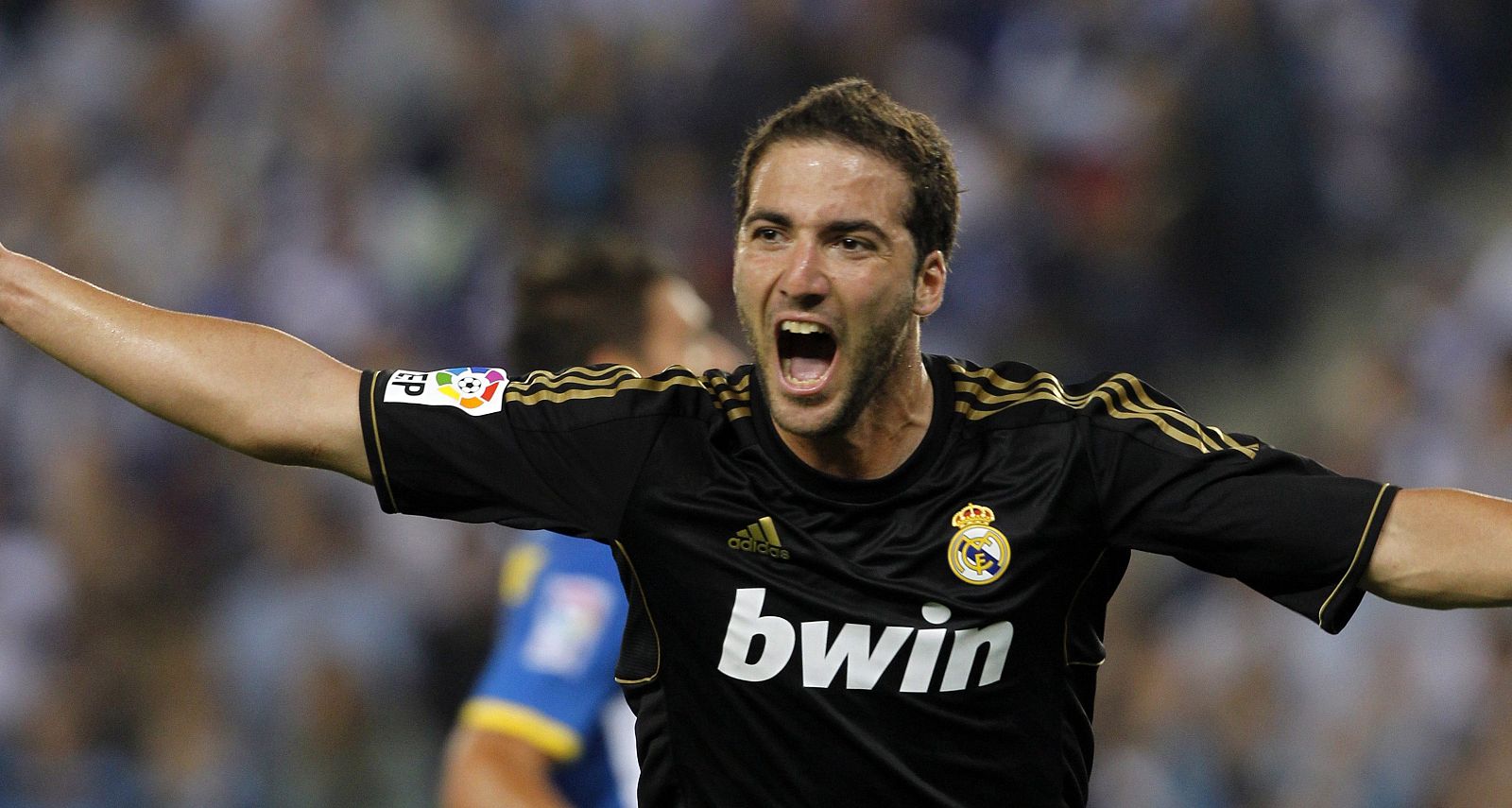 Real Madrid's Higuain celebrates a goal against Espanyol during their Spanish First division soccer match at Cornella-El Prat stadium