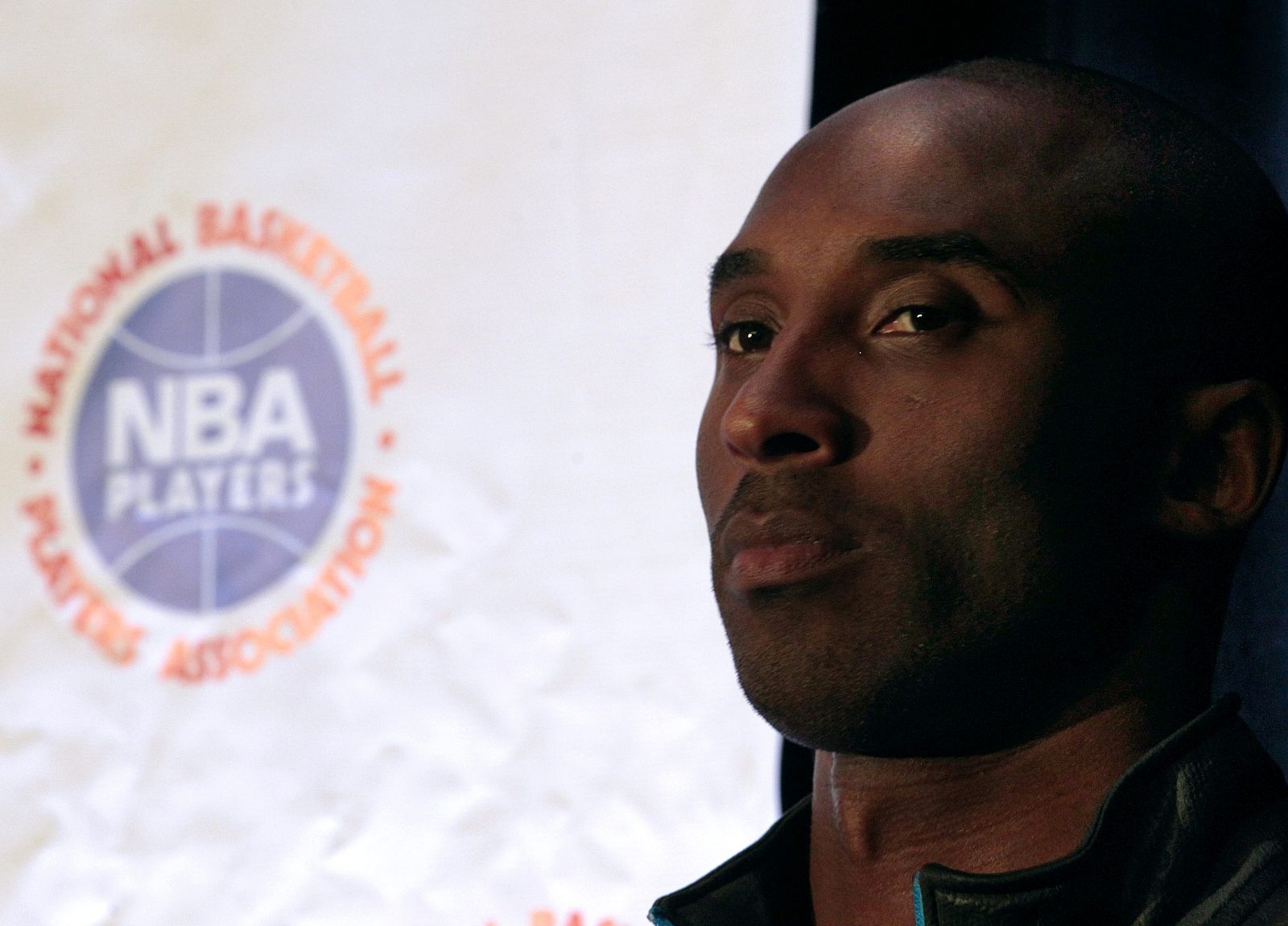 Los Angeles Laker's Kobe Bryant listens during a news conference following NBA labor meetings in New York