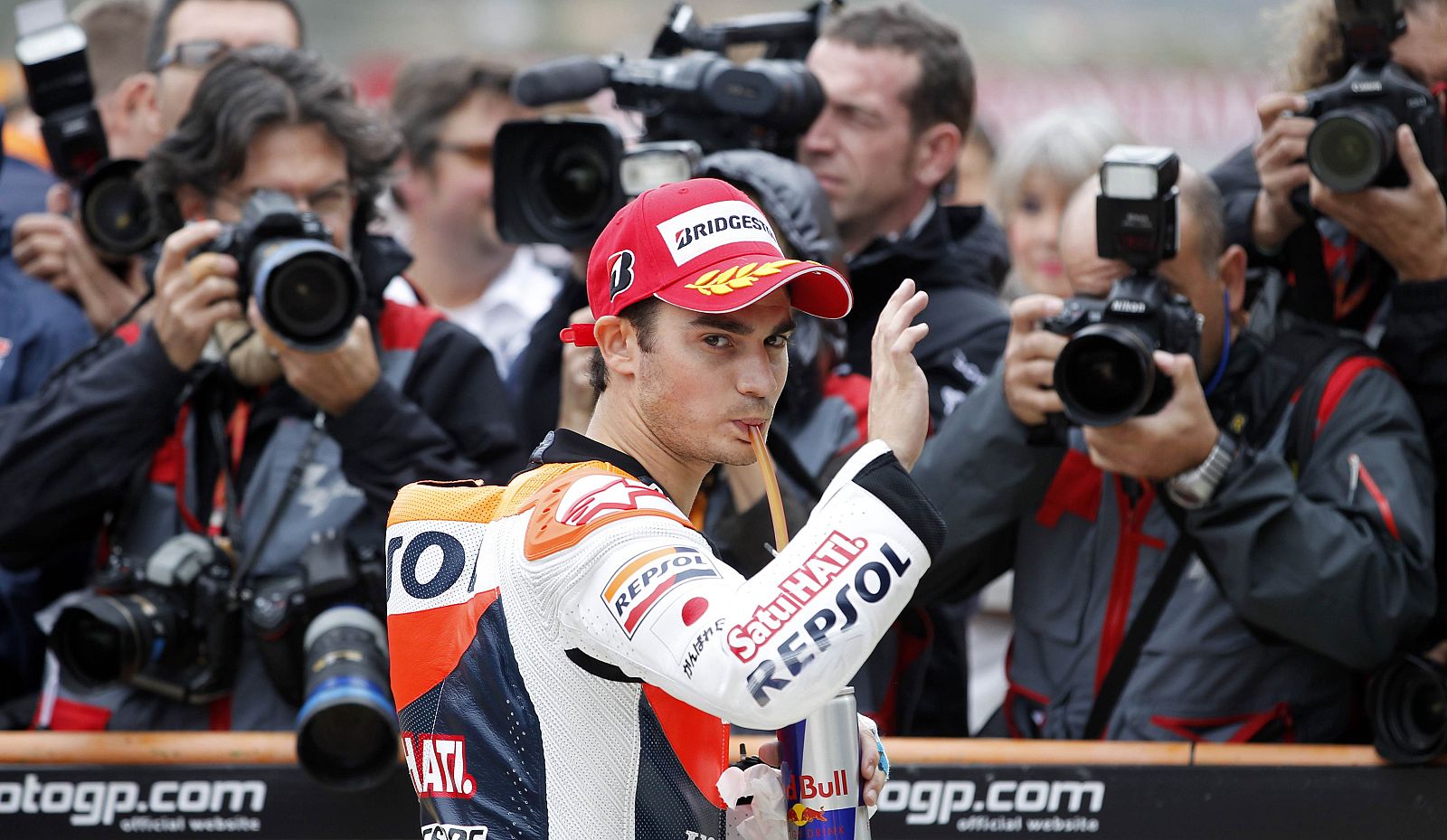Honda MotoGP rider Dani Pedrosa of Spain salutes after his second place during the qualifying session of the Valencia Motorcycle Grand Prix at the Ricardo Tormo racetrack in Cheste, near Valencia