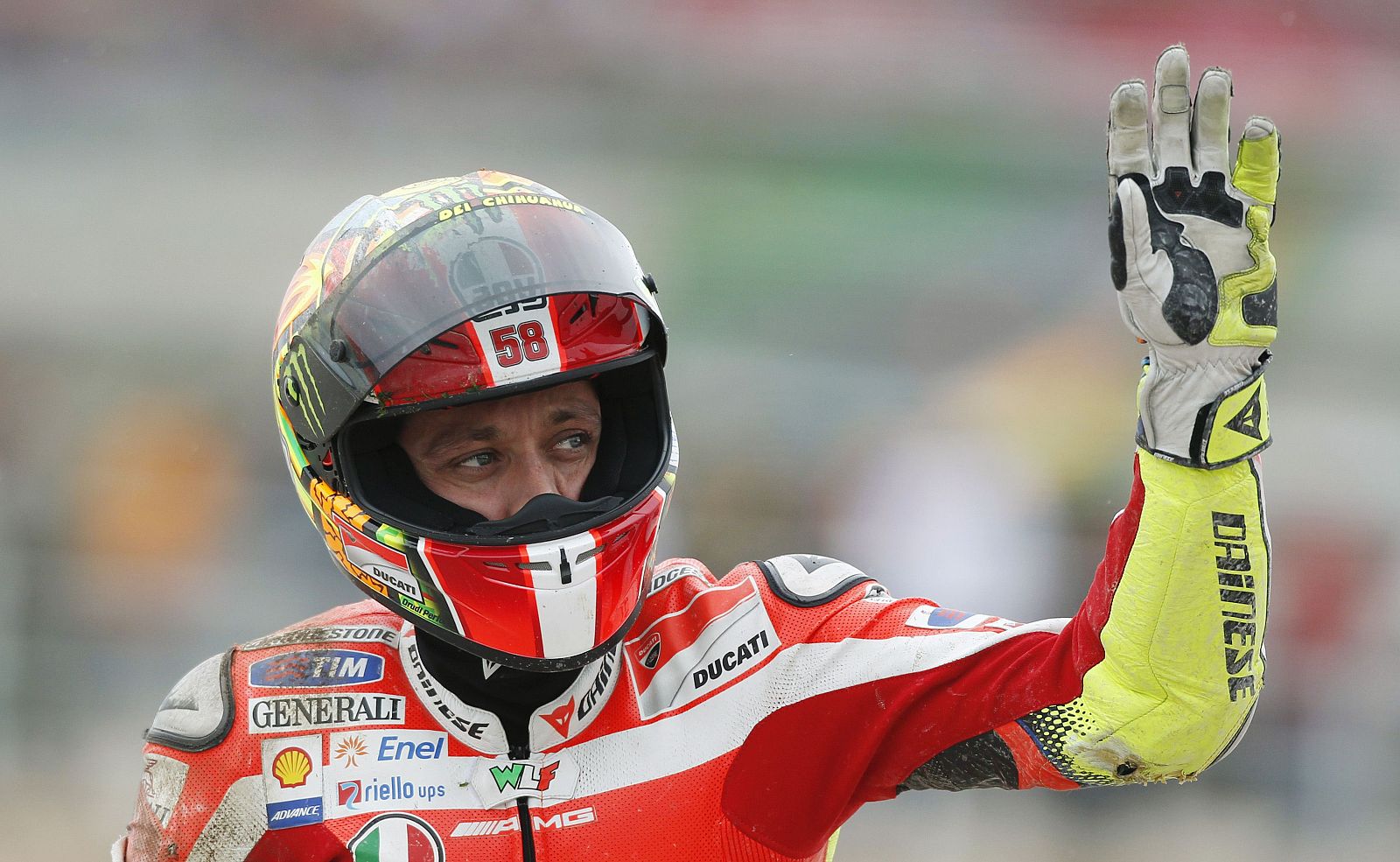 Ducati MotoGP rider Rossi waves at the crowd after a crash during the Valencia Motorcycle Grand Prix in Cheste