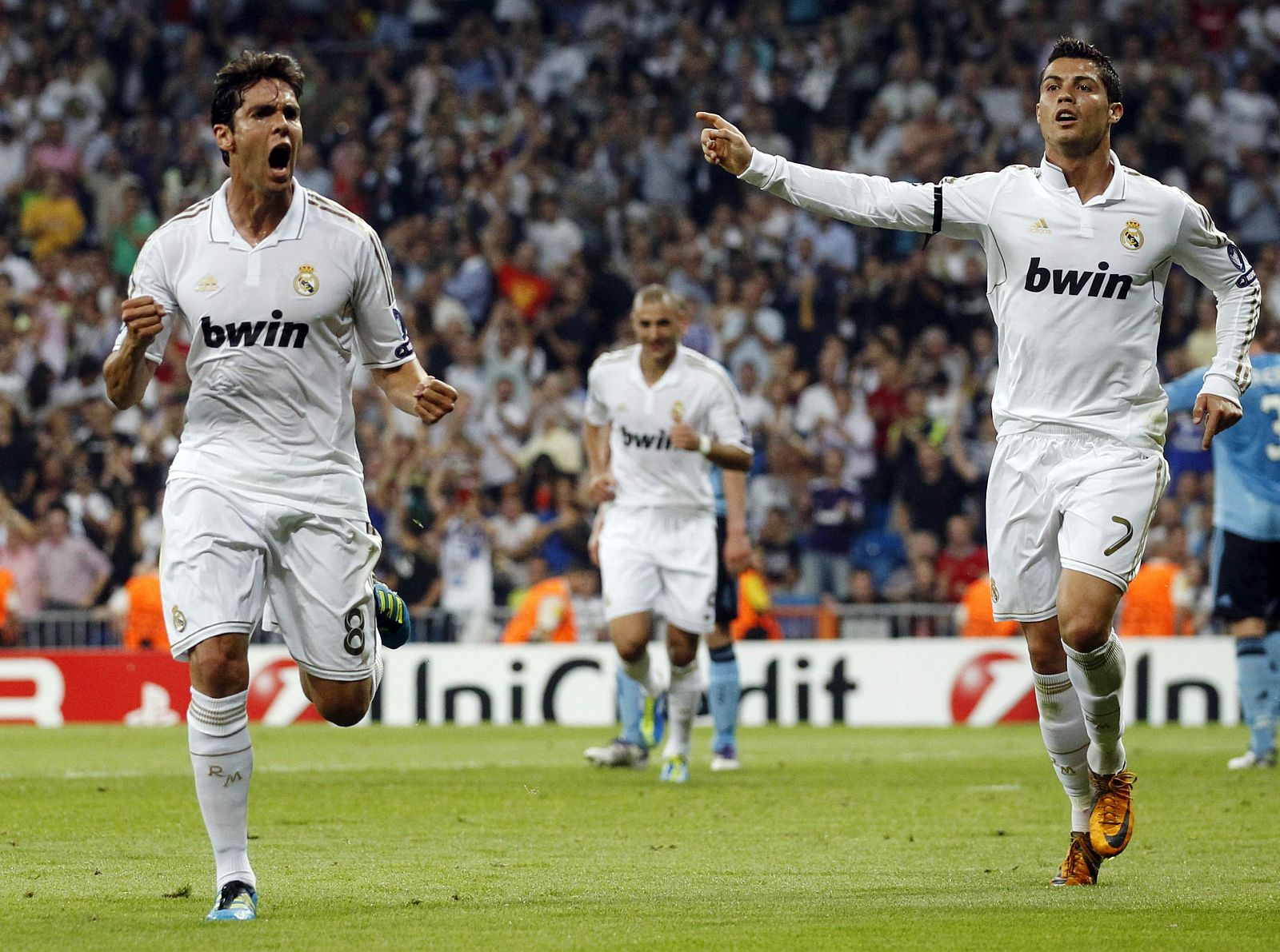 Real Madrid's Kaka celebrates with teammate Ronaldo after scoring against Ajax Amsterdam during their Champions League soccer match in Madrid