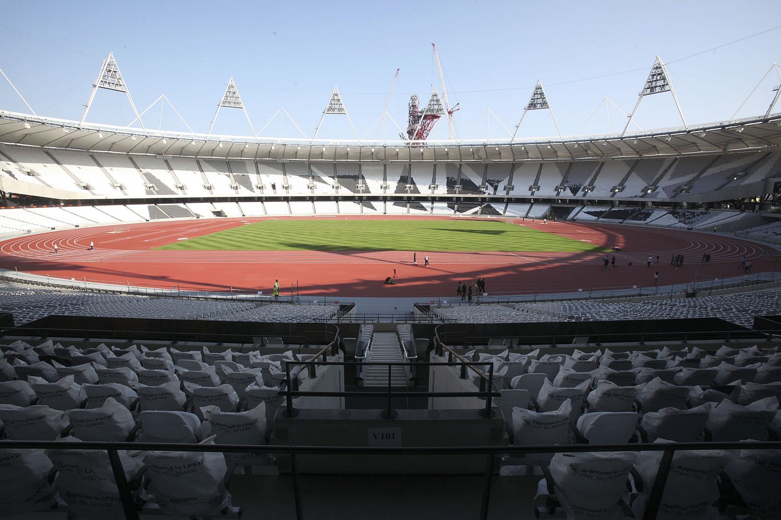 The completed athletics track is seen inside the London 2012 Olympic Stadium in this photograph received in London