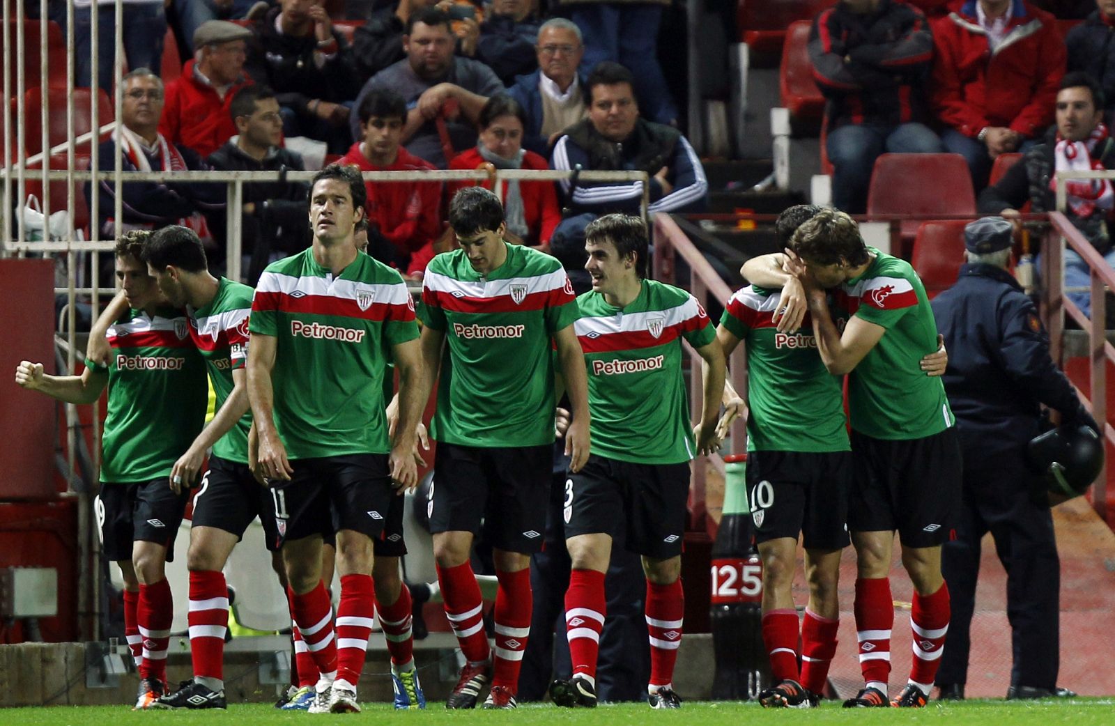 Athletic Bilbao's De Marcos celebrates with teammates after scoring against Sevilla in Seville