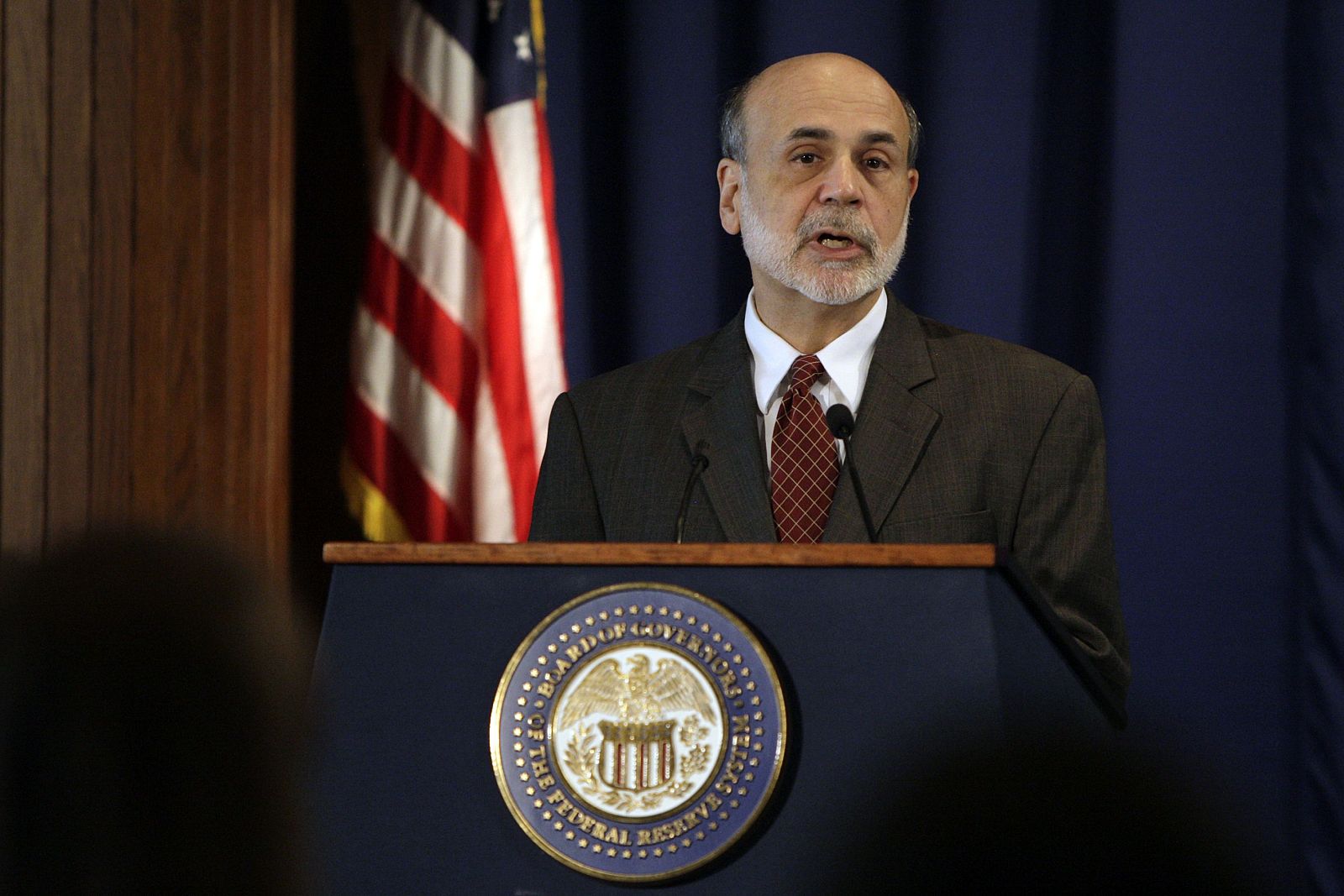 Federal Reserve Chairman Ben Bernanke delivers opening remarks at a conference in Washington