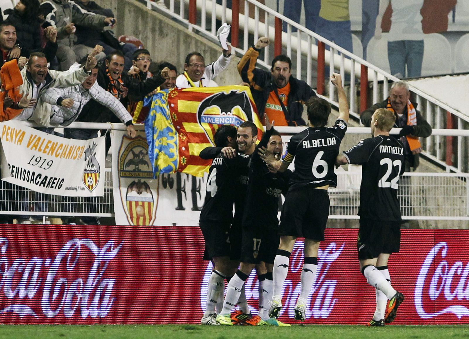 Valencia players celebrate teammate Roberto Salgado's goal during their Spanish First Division soccer match against Rayo Vallecano at Teresa Rivero stadium in Madrid