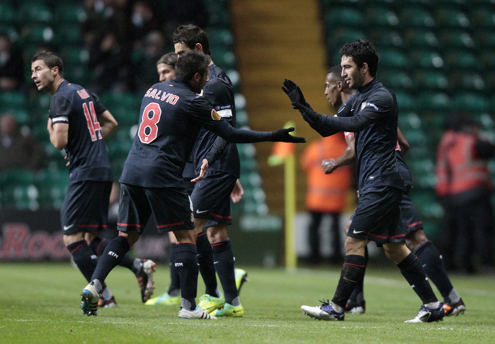 Atletico Madrid's Turan celebrates with teammates after scoring against Celtic during their Europa League Group I soccer match at Celtic Park stadium in Glasgow