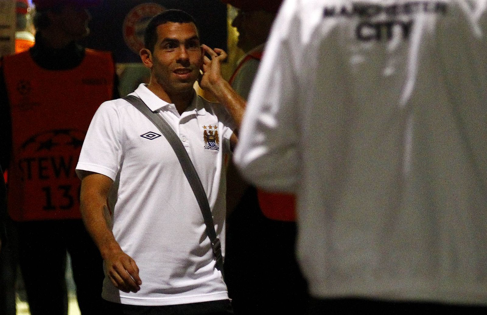 Carlos Tevez of Manchester City walks towards his team's bus after the Champions League Group A soccer match against Bayern Munich in Munich