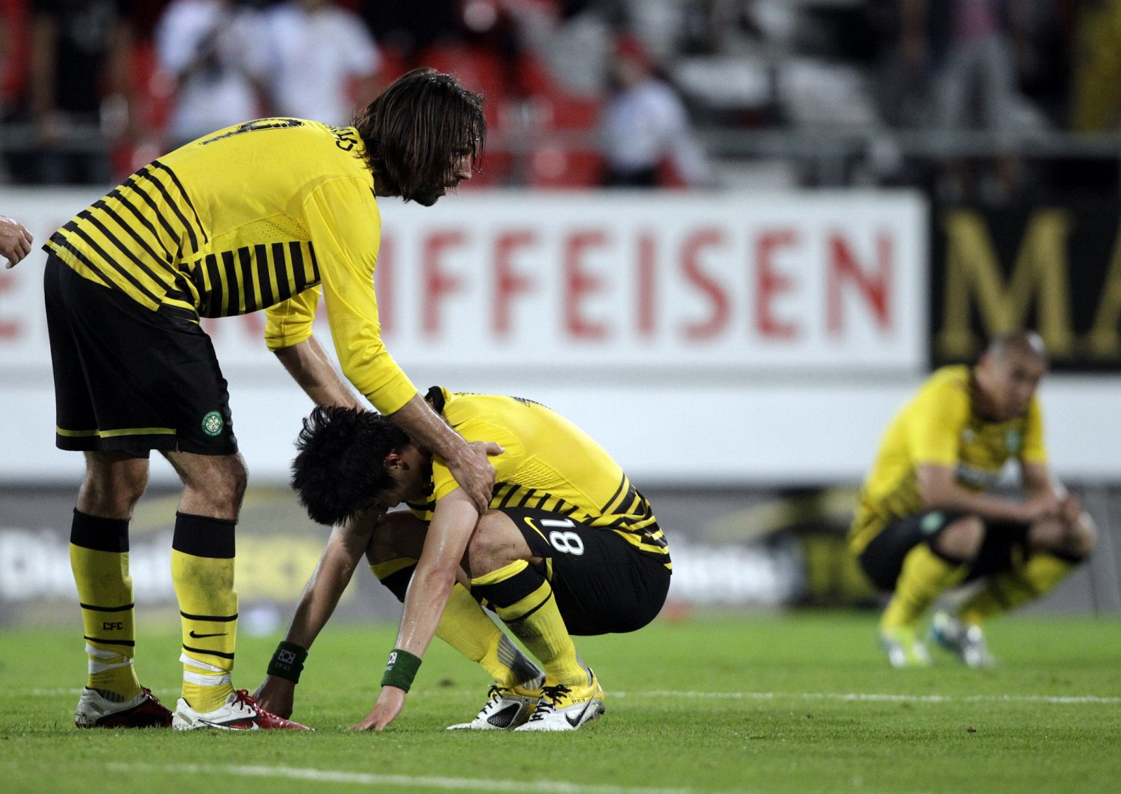 Celtic's Samaras comforts Ki next to Cha after losing their Europa League soccer match against FC Sion in Sion