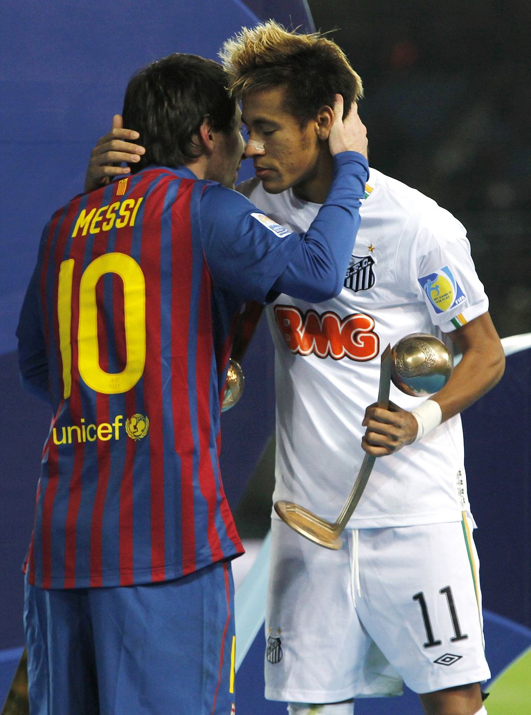 Messi of Spain's Barcelona is greeted by Neymar of Brazil's Santos after their Club World Cup final soccer match in Yokohama
