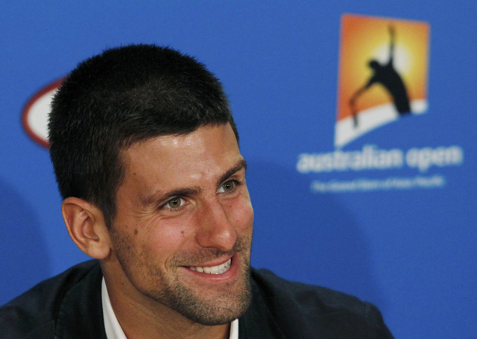 Djokovic of Serbia smiles during a news conference before the Australian Open tennis tournament in Melbourne