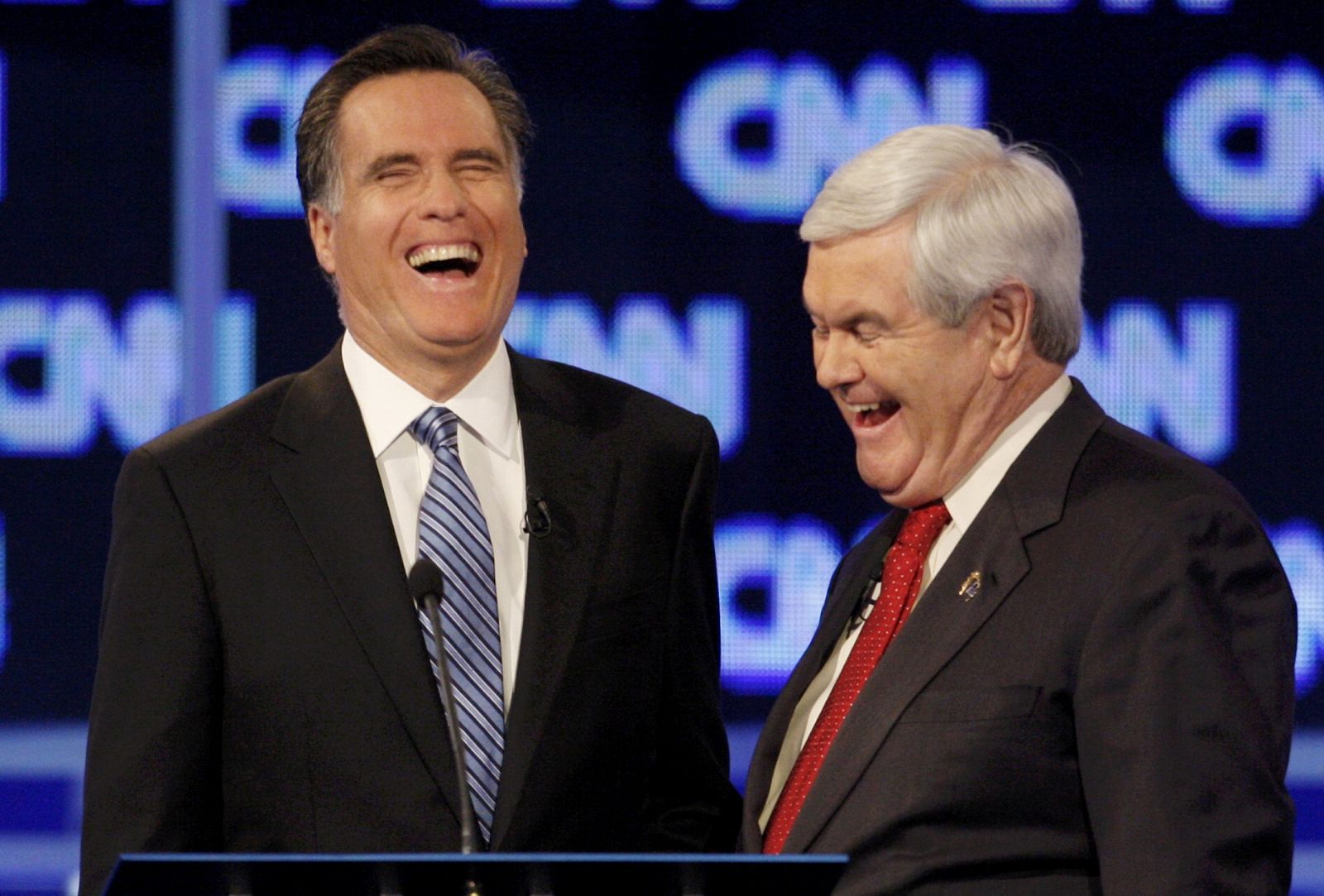 Republican presidential candidates Romney and Gingrich share a laugh during a break in the Republican presidential candidates debate in Charleston