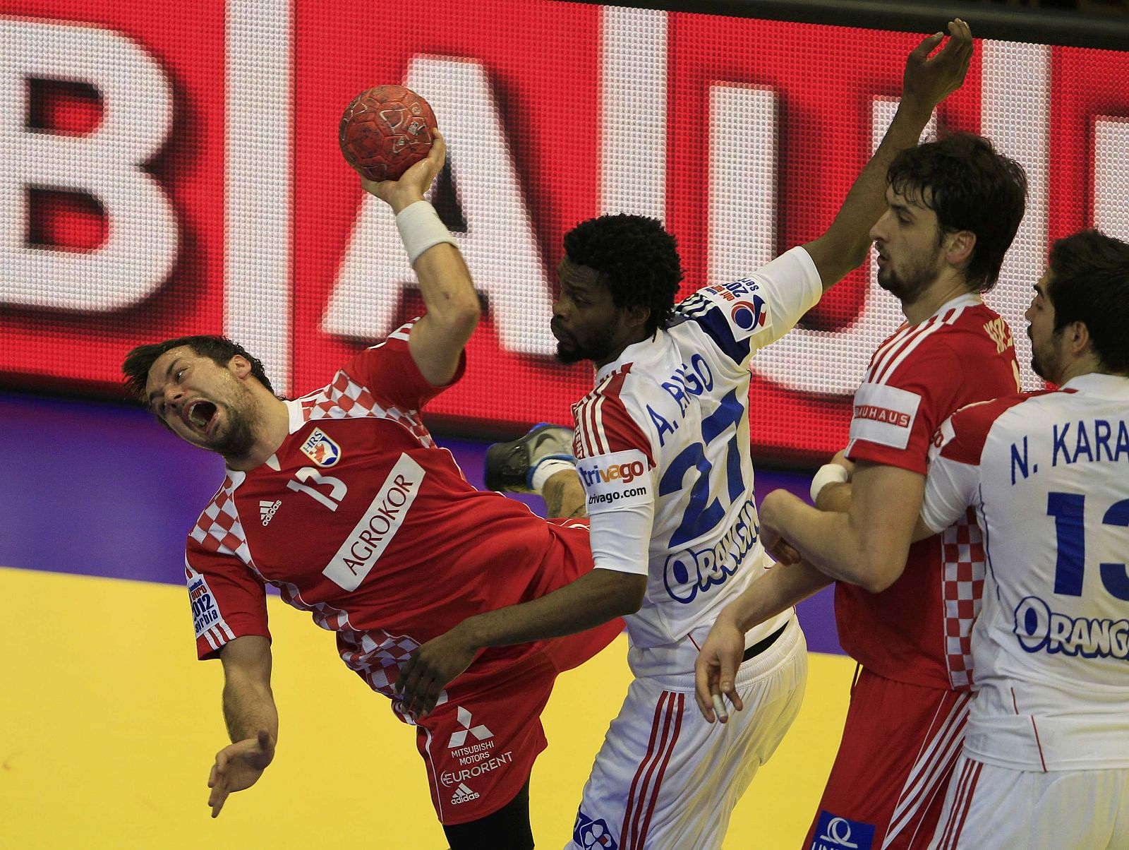 Croatia's Horvat tries to score against France's Bingo during their Men's European Handball Championship main round match in Novi Sad