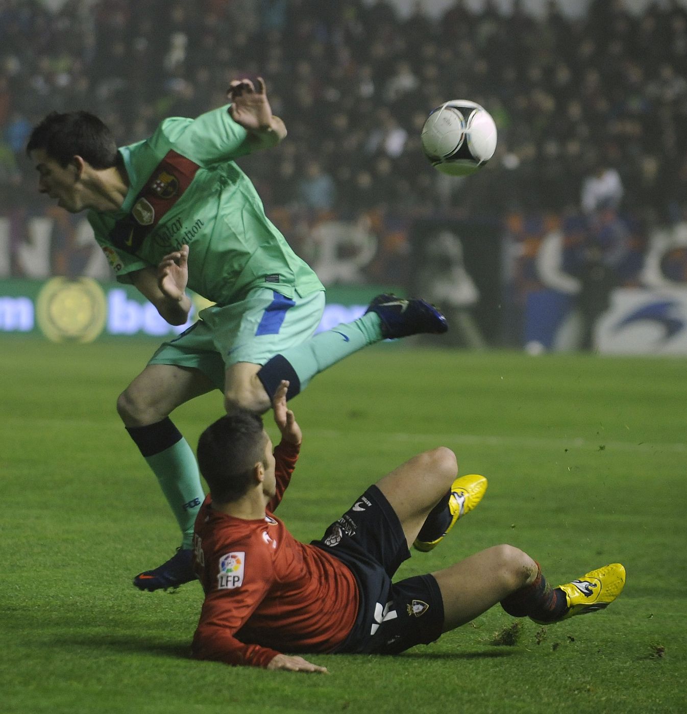 Osasuna's Cejudo and Barcelona's Cuenca fight for the ball during their Spanish King's Cup soccer match at Reyno de Navarra stadium in Pamplona