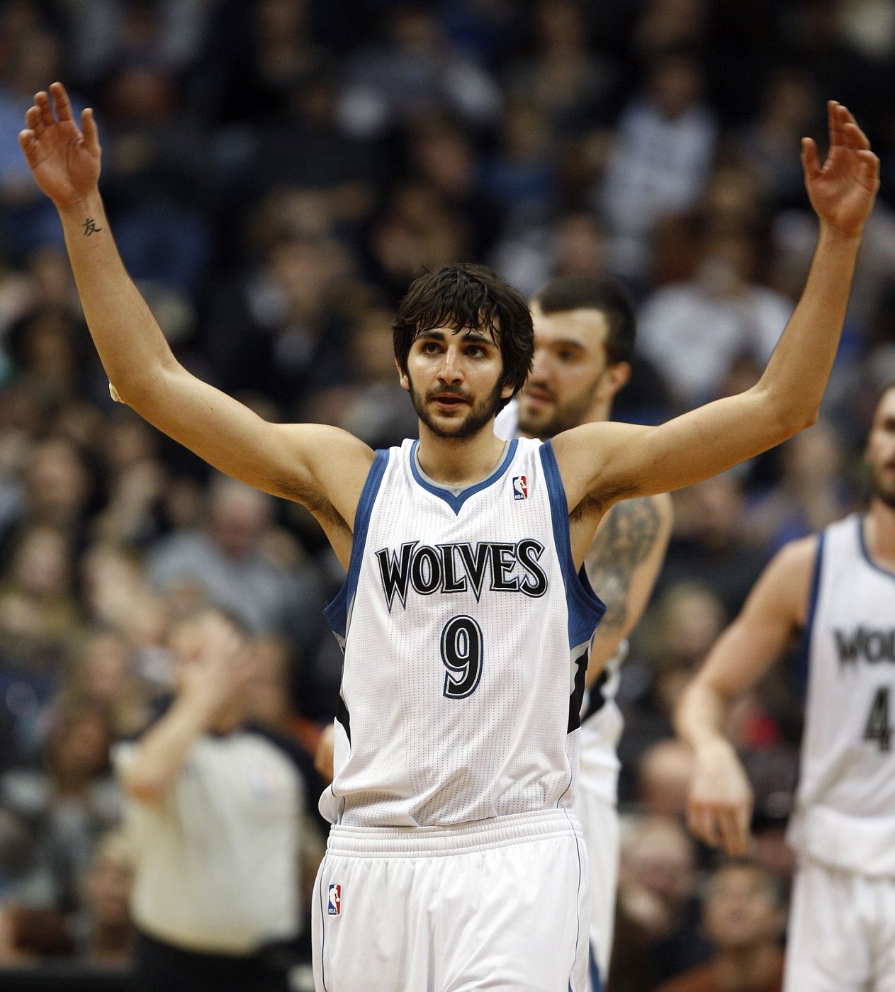 Minnesota Timberwolves guard Rubio encourages fans to cheer near end of the Timberwolves' 87-79 win against San Antonio Spurs in their NBA basketball game in Minneapolis