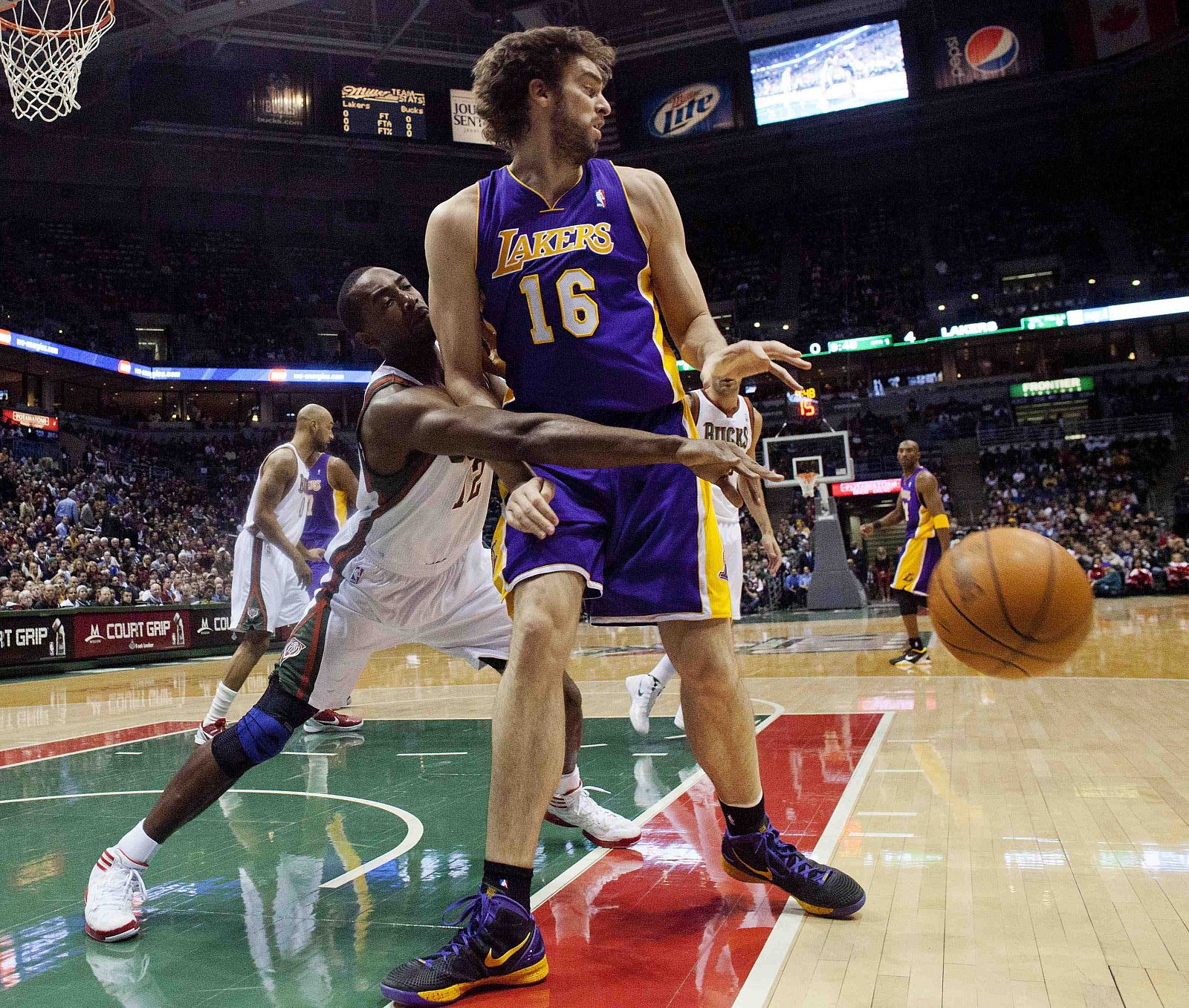 Los Angeles Lakers' Gasol has the ball stripped by Milwaukee Bucks' Mbah a Moute during their NBA game in Milwaukee