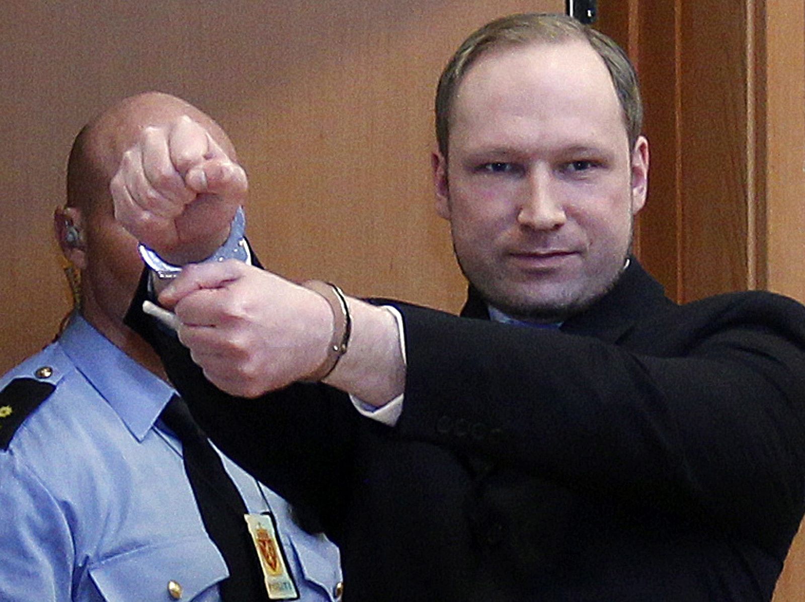 Norwegian Breivik, who killed 77 people, arrives at a court hearing in Oslo