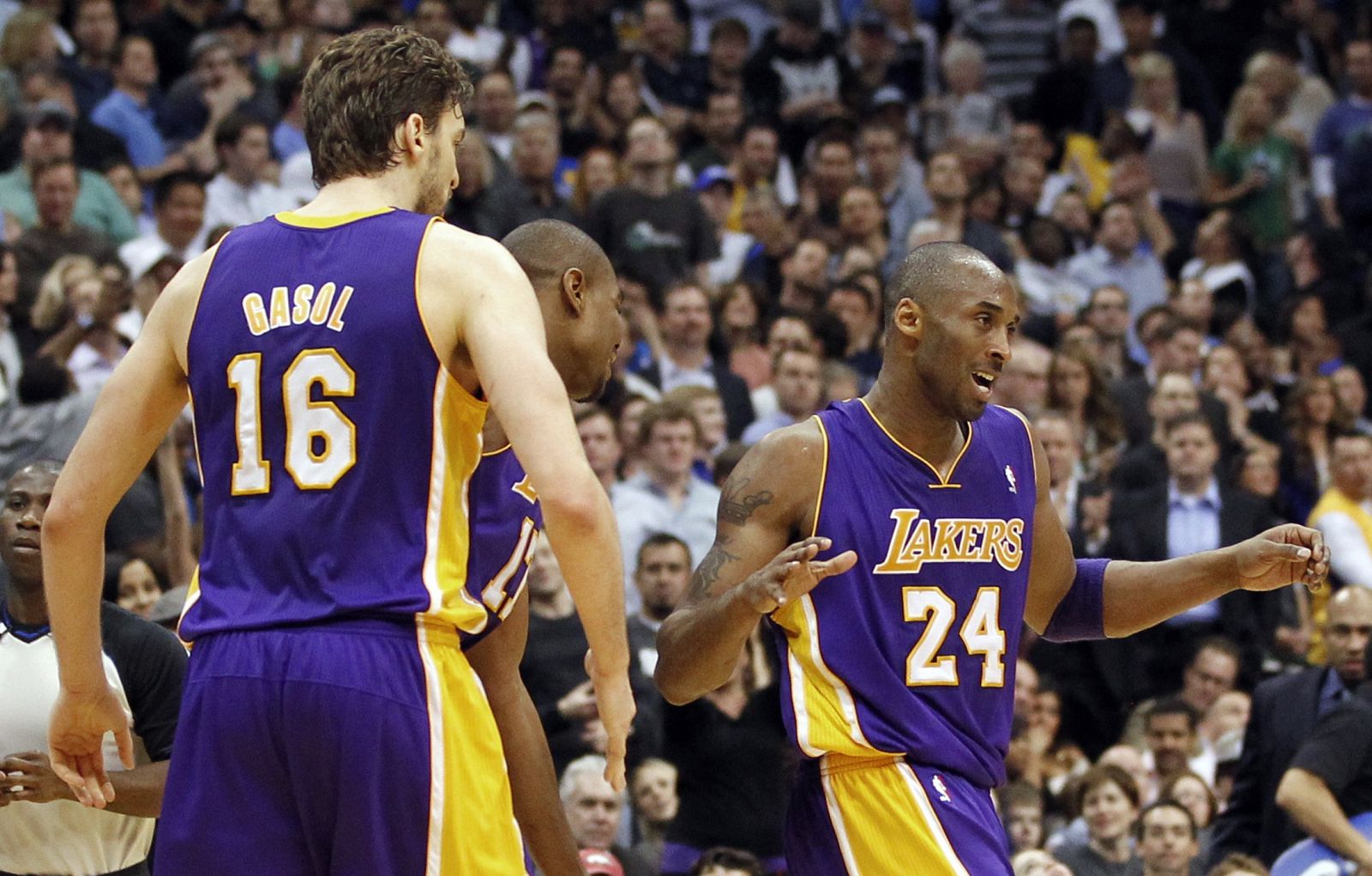 Lakers Gasol, Bynum and Bryant react during their NBA basketball game against the Mavericks in Dallas
