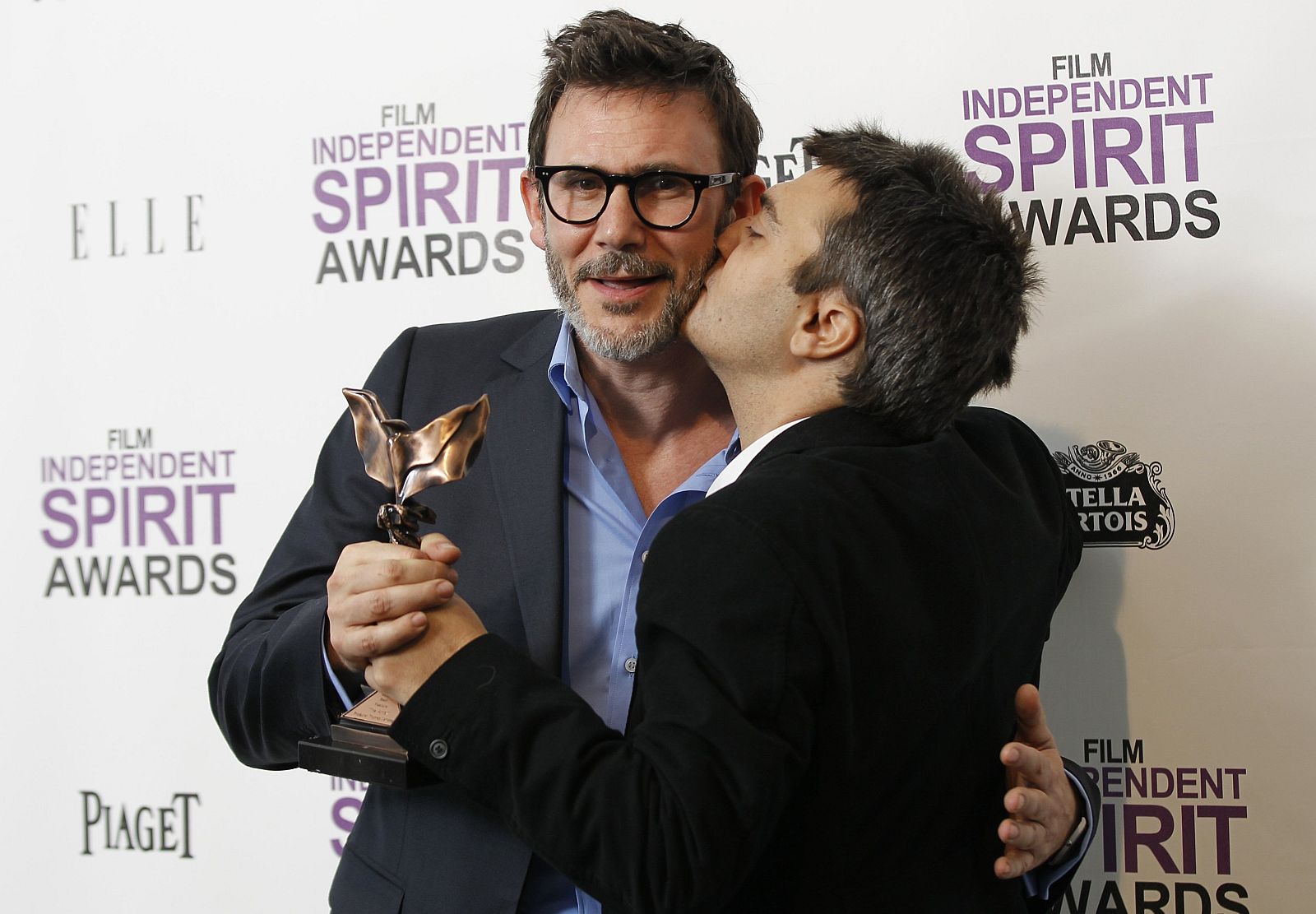 Thomas Langmann, producer of "The Artist", poses with the best picture award with director Michel Hazanavicius backstage at the 2012 Film Independent Spirit Awards in Santa Monica