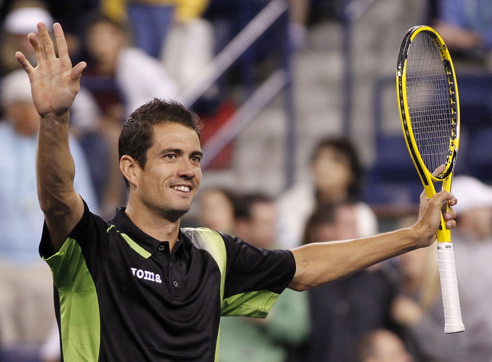 Guillermo Garcia-Lopez of Spain celebrates after defeating Andy Murray of Britain during their match at the Indian Wells ATP tennis tournament in Indian Wells, California