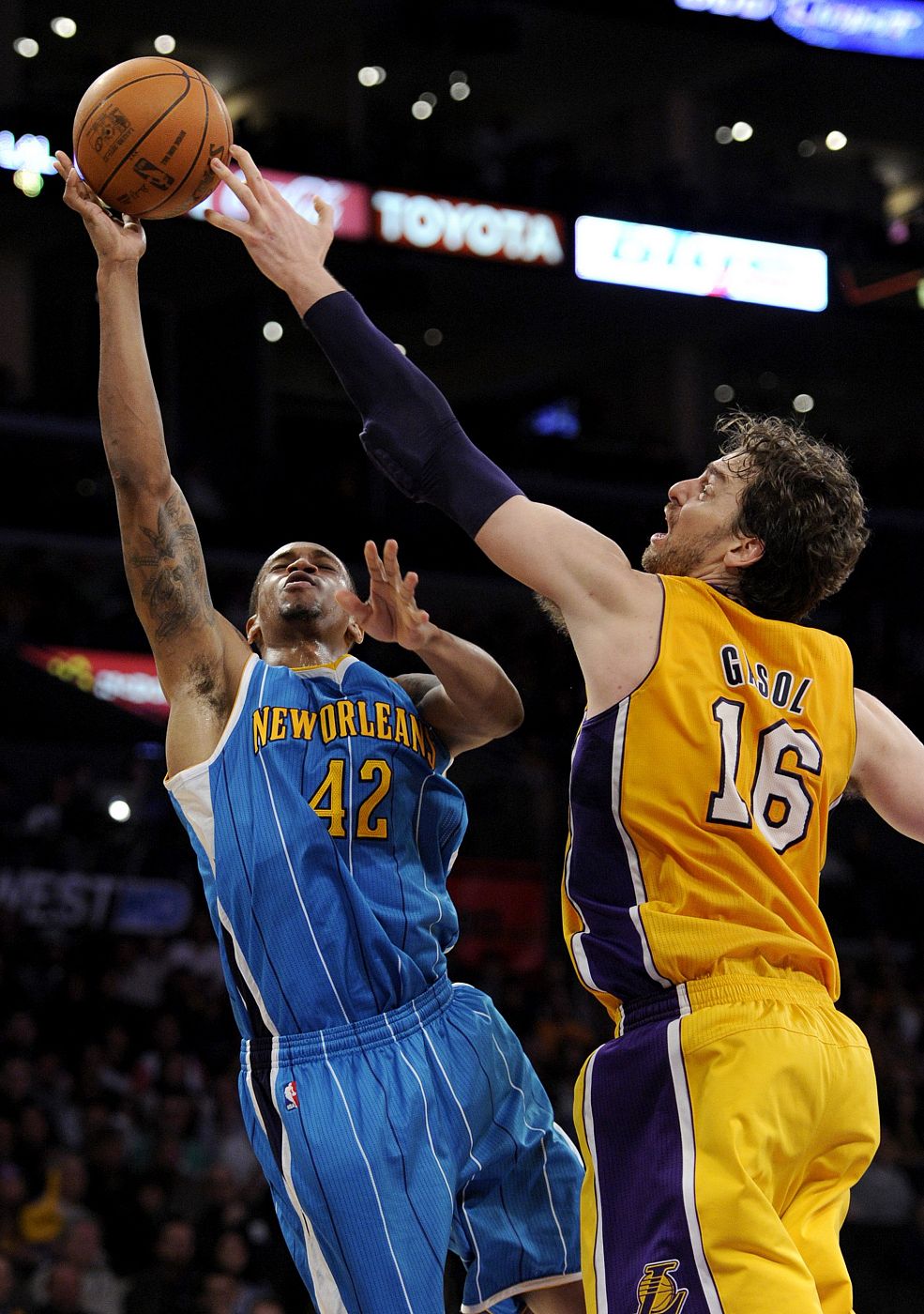 Los Angeles Lakers power forward Pau Gasol blocks the a shot by New Orleans Hornets forward Lance Thomas in Los Angeles