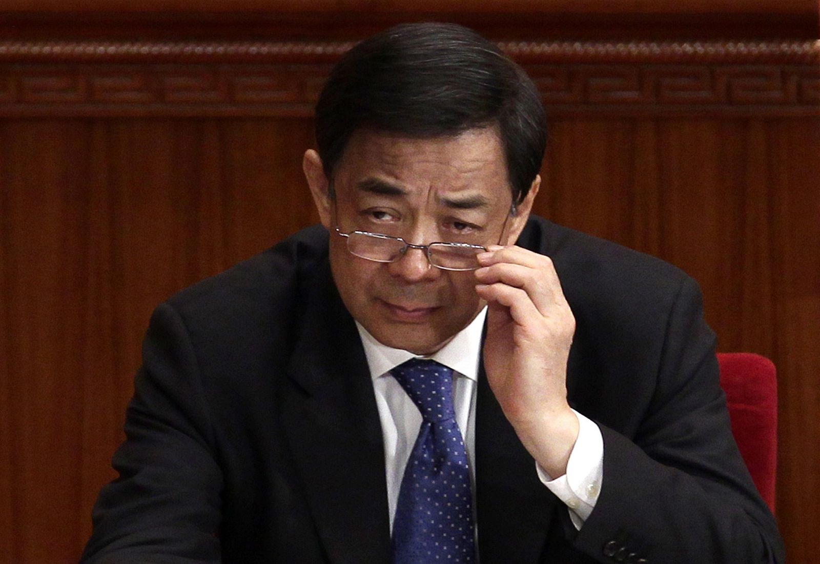 File picture shows China's Chongqing Municipality Communist Party Secretary Bo adjusting his glasses in Beijing