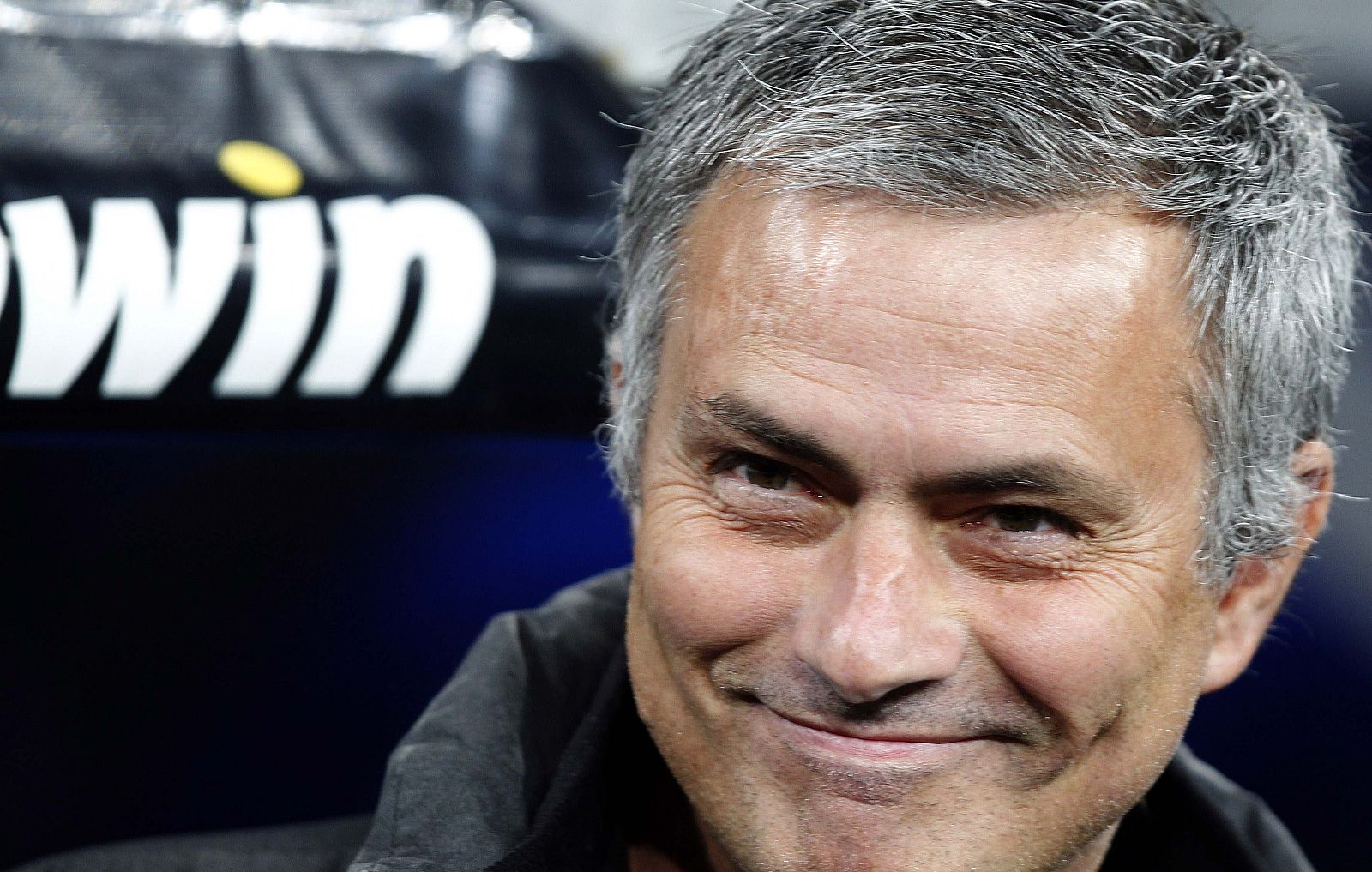 Real Madrid's coach Mourinho smiles before his Spanish first division soccer match against Valencia in Madrid