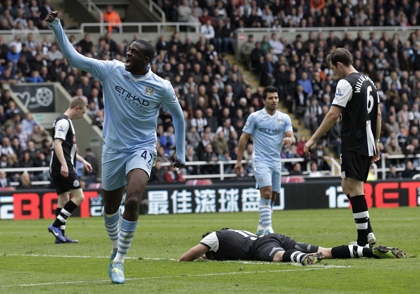 Manchester City's Toure celebrates scoring second goal against Newcastle United during English Premier League soccer match in Newcastle