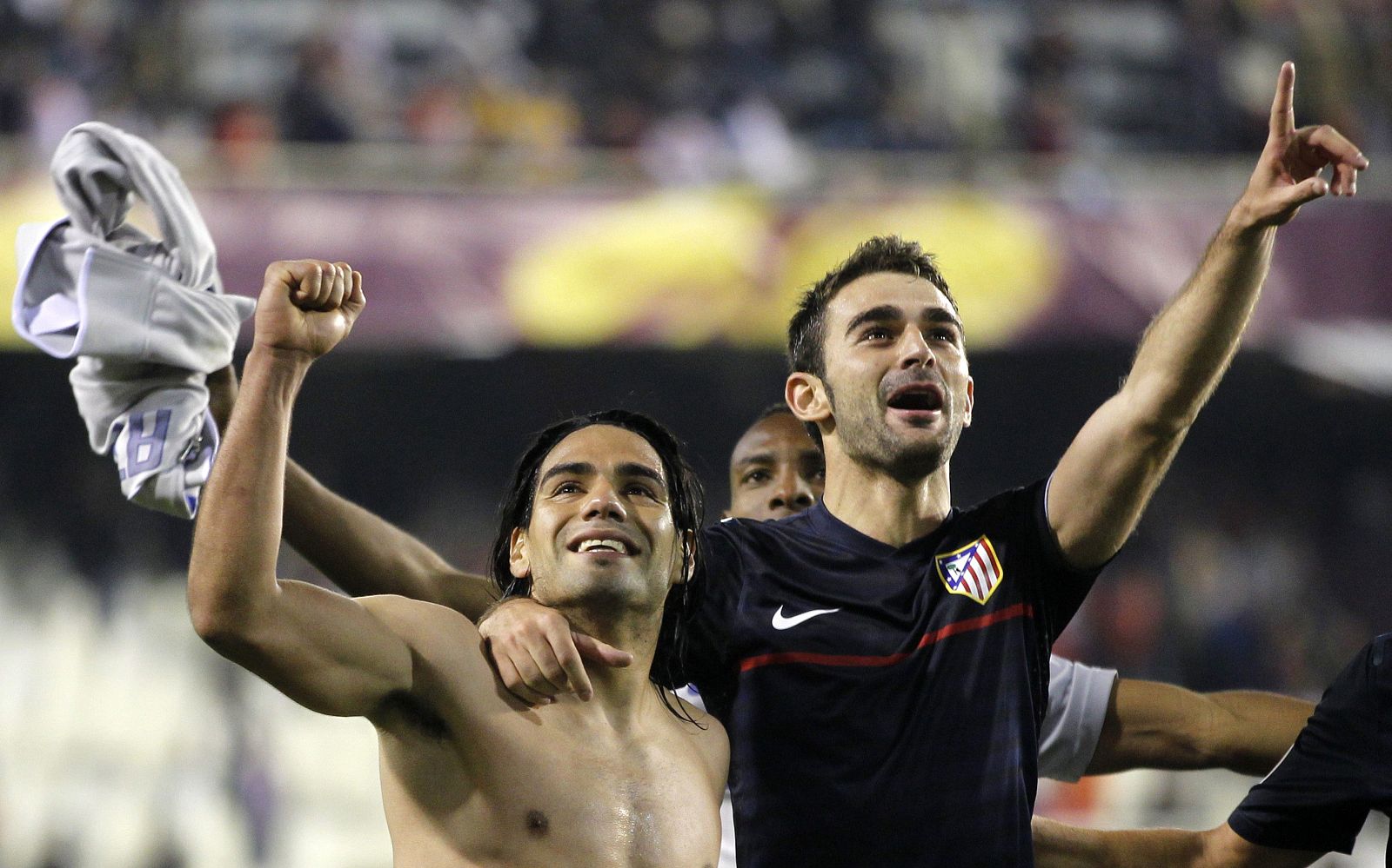 Atletico Madrid's Falcao and Adrian celebrate after beating Valencia at the end of their Europa League semi-final second leg soccer match