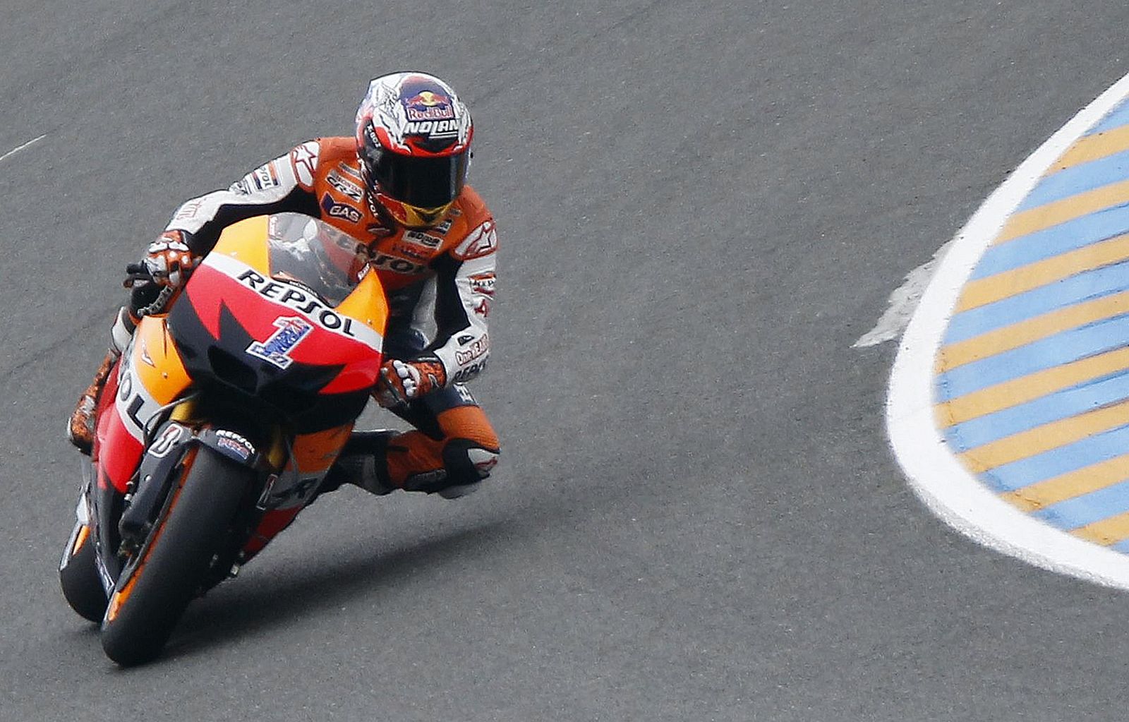 Honda MotoGP rider Casey Stoner of Australia takes a curves during free practice for the MotoGP motorcycling French Grand Prix at the Le Mans circuit in central France