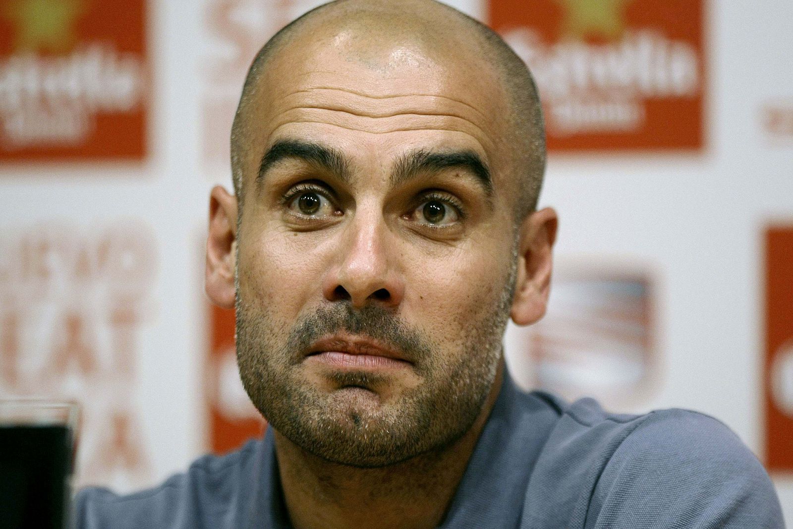 Barcelona's coach Pep Guardiola attends a news conference at Nou Camp stadium