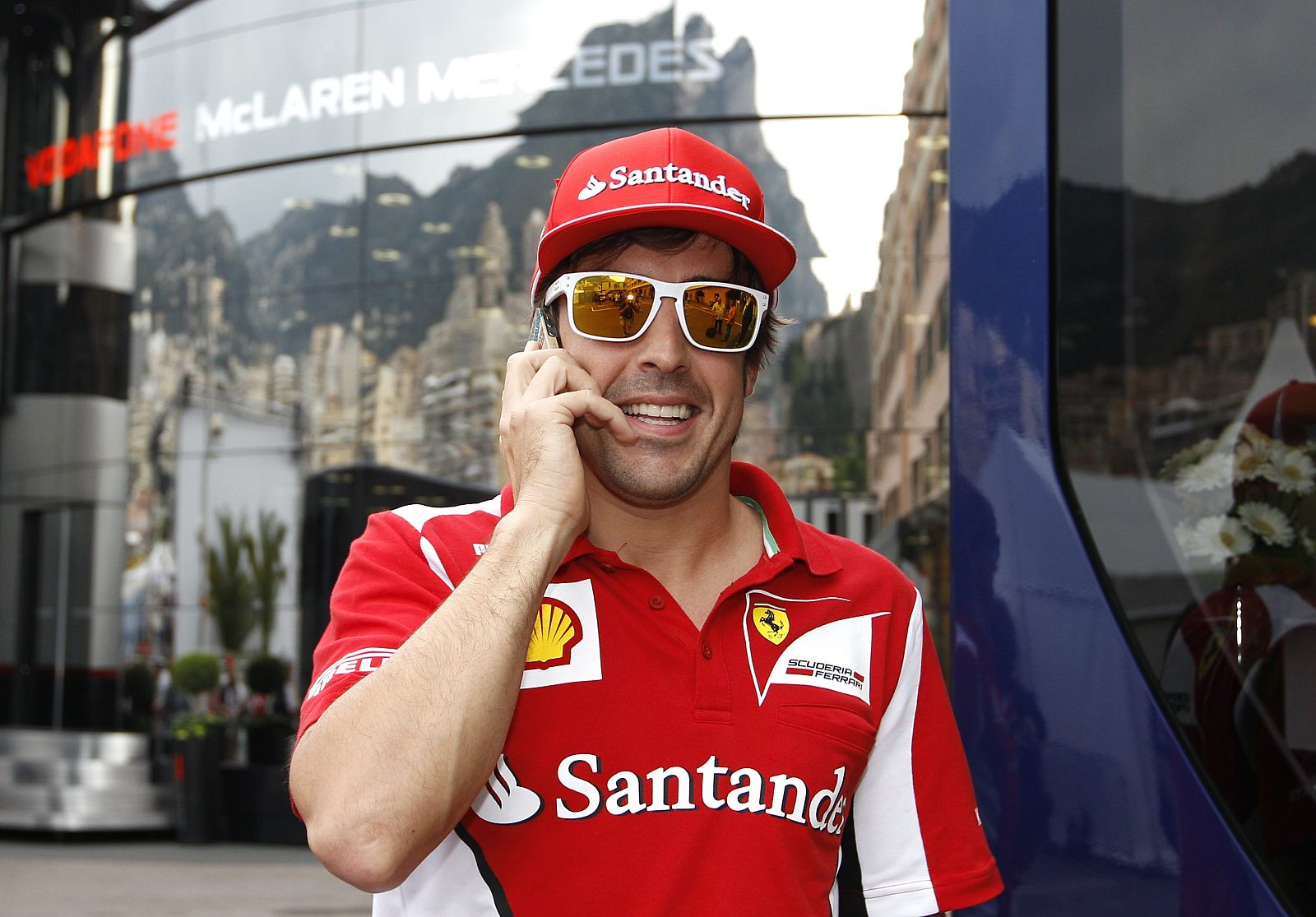Ferrari Formula One driver Alonso of Spain speaks on the phone during the Monaco F1 Grand Prix