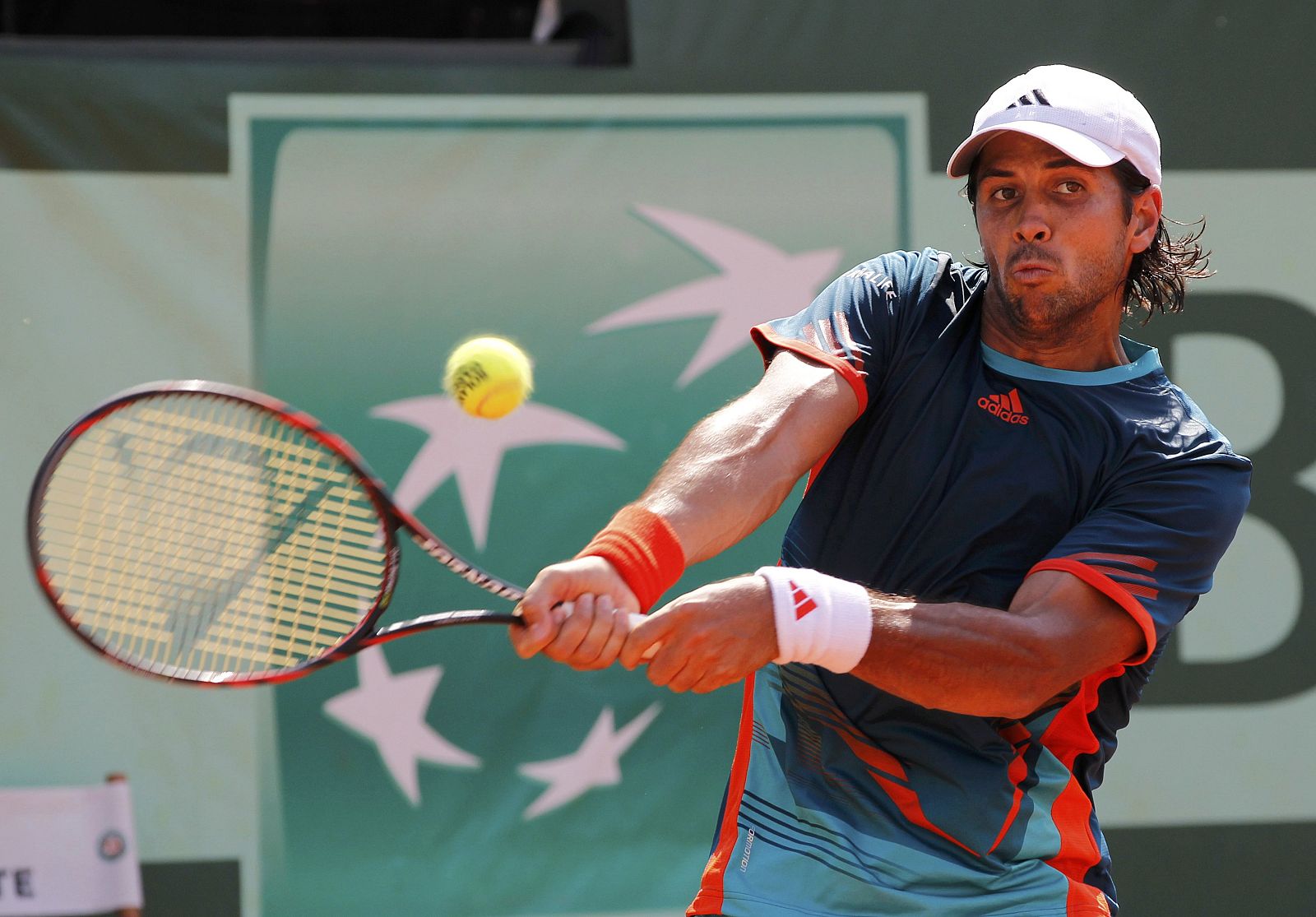 Verdasco of Spain returns the ball to Darcis of Belgium during the French Open tennis tournament at the Roland Garros stadium in Paris