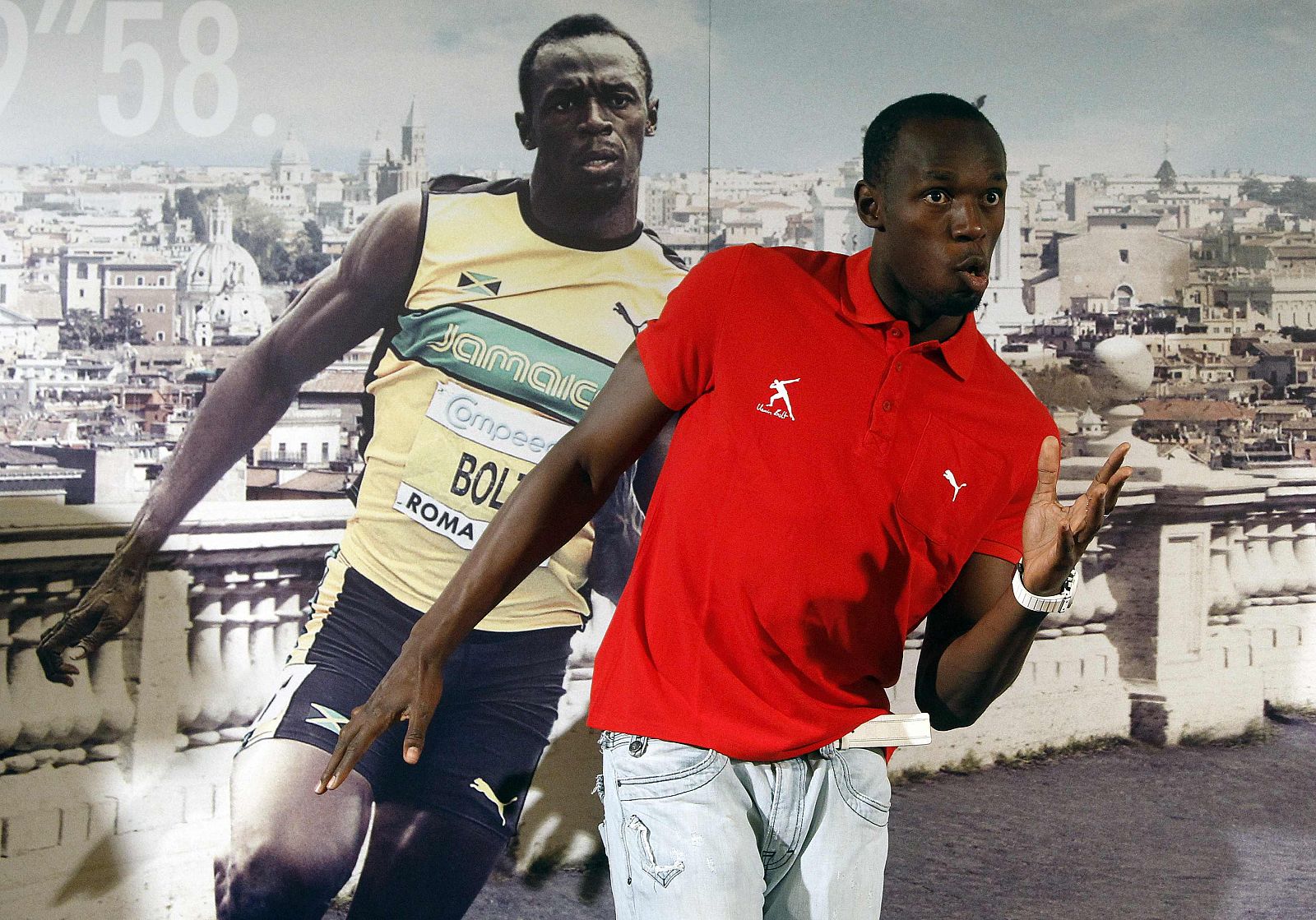 Jamaican sprinter Usain Bolt gestures before a news conference in Rome