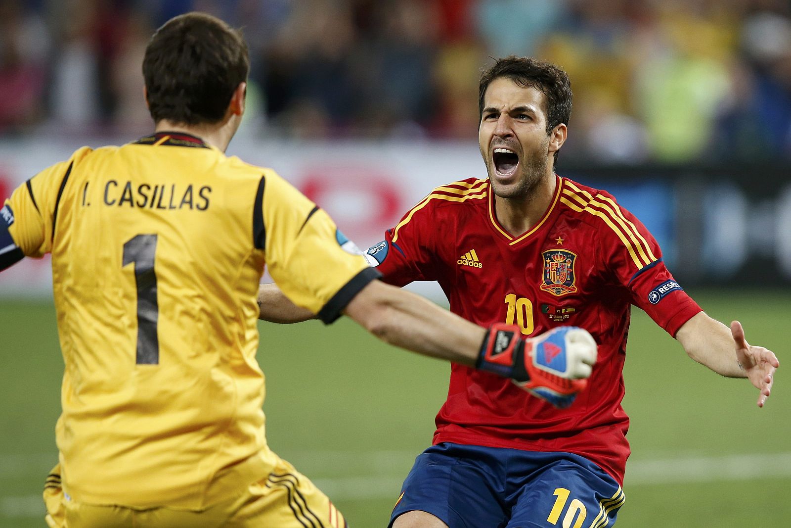 Spain's Fabregas celebrates with goalkeeper Casillas after scoring the winning penalty goal against Portugal during the penalty shoot-out in their Euro 2012 semi-final soccer match at the Donbass Arena in Donetsk