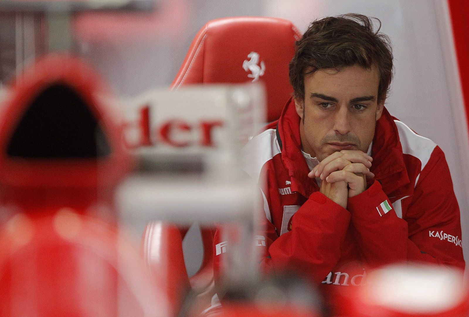 Ferrari F1 Formula One driver Alonso of Spain waits in his garage during second practice session of German F1 Grand Prix at Hockenheimring in Hockenheim
