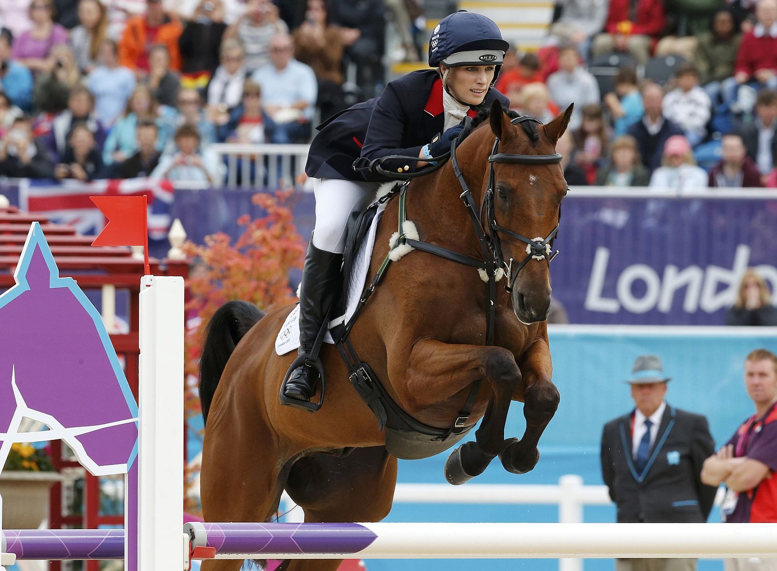 Britain's Zara Phillips clears a fence during the Eventing Jumping equestrian event at the London 2012 Olympic Games in Greenwich Park